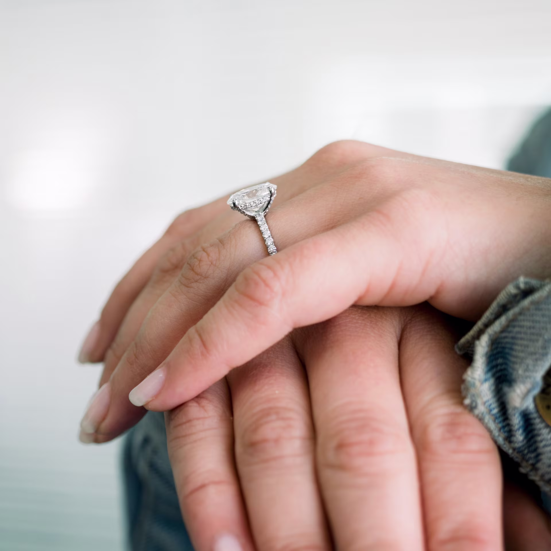 diamond prongs on oval petite pave engagement ring in platinum