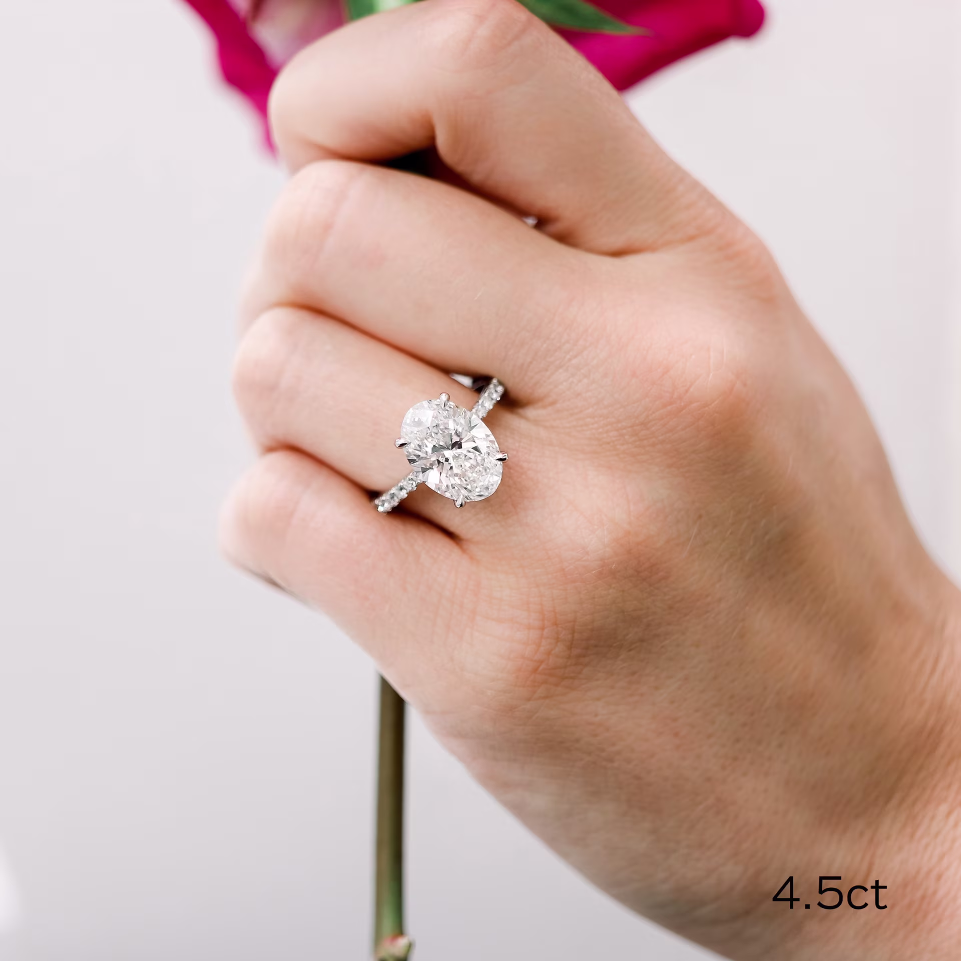 Platinum 4.5ct oval cathedral pavé lab diamond engagement ring with hidden halo ada diamonds design ad190 on model