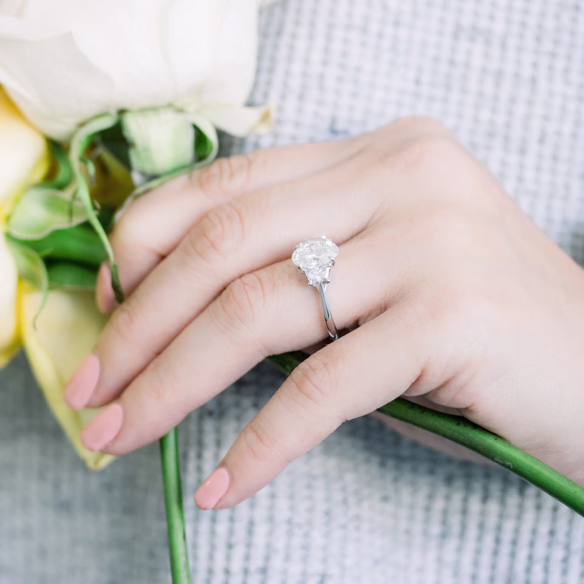 white gold profile view of 2.5 carat oval and trapezoid three stone lab grown diamond engagement ring ada diamonds design ad 462