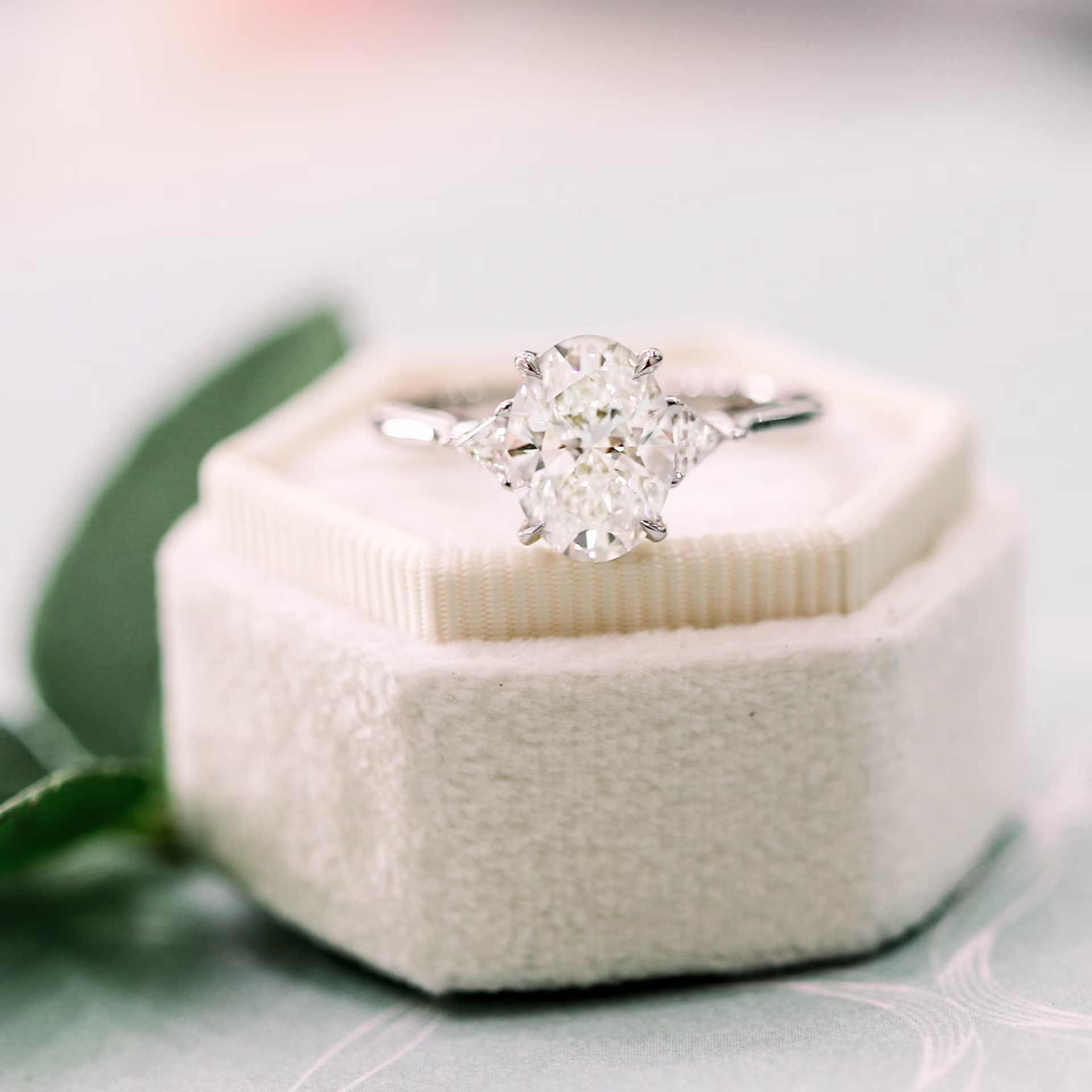 18k white gold oval and trillion setting featuring gia graded laboratory grown diamonds