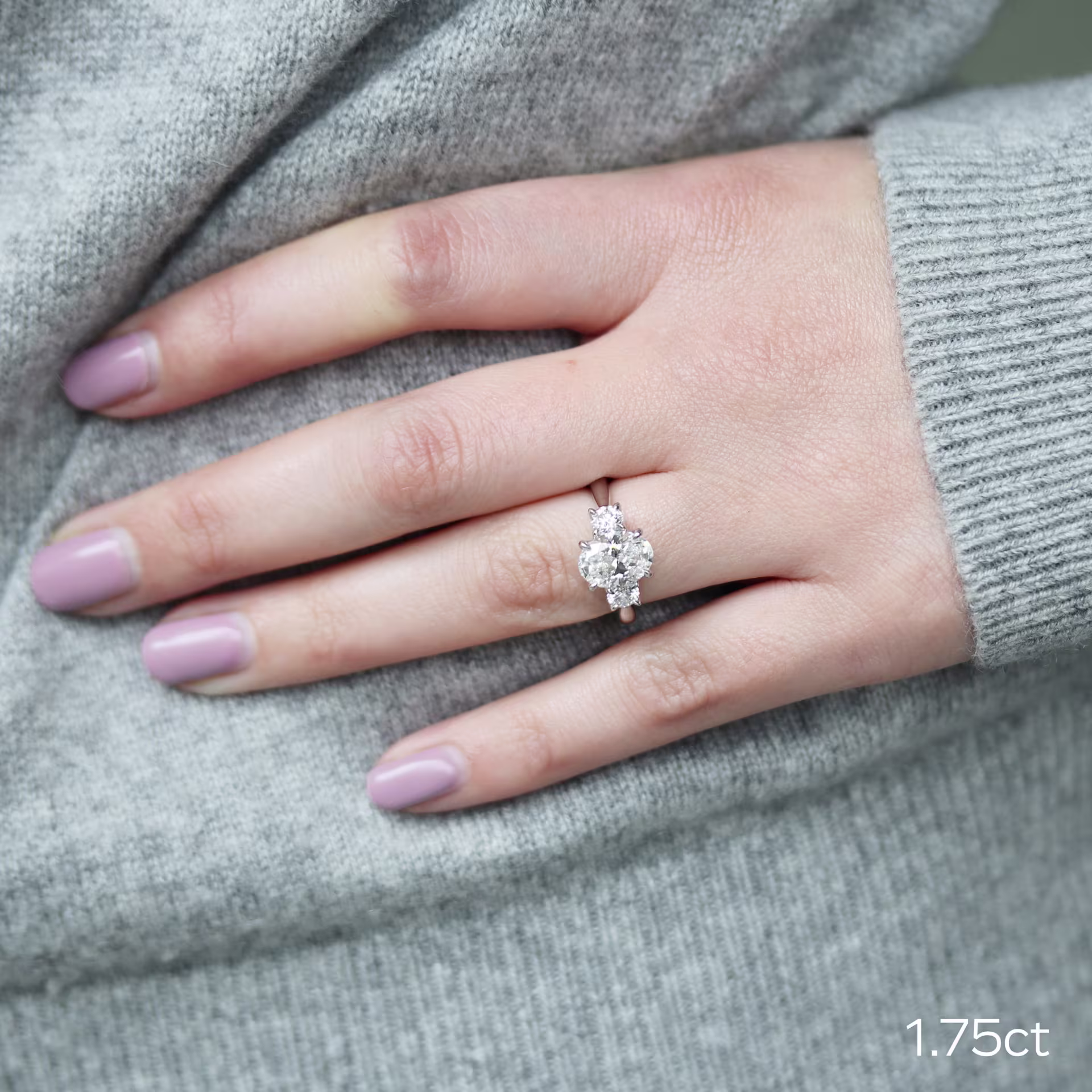 white gold oval and round engagement ring featuring 1.75ct oval lab grown diamond