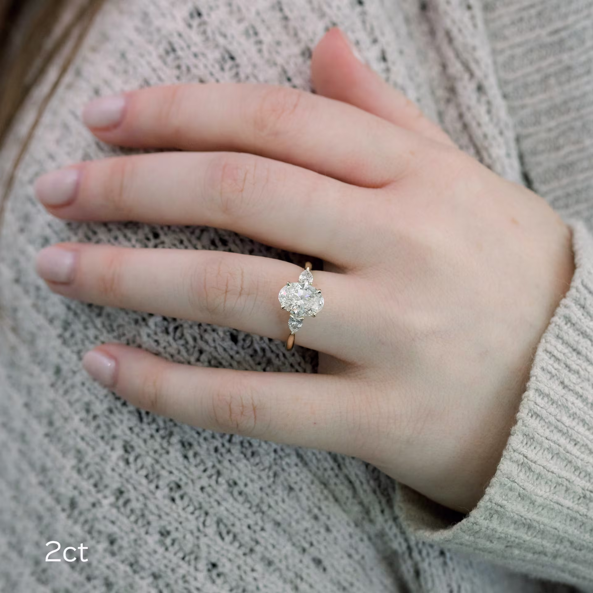 14k gold 2 carat oval lab made diamond with pear side stones