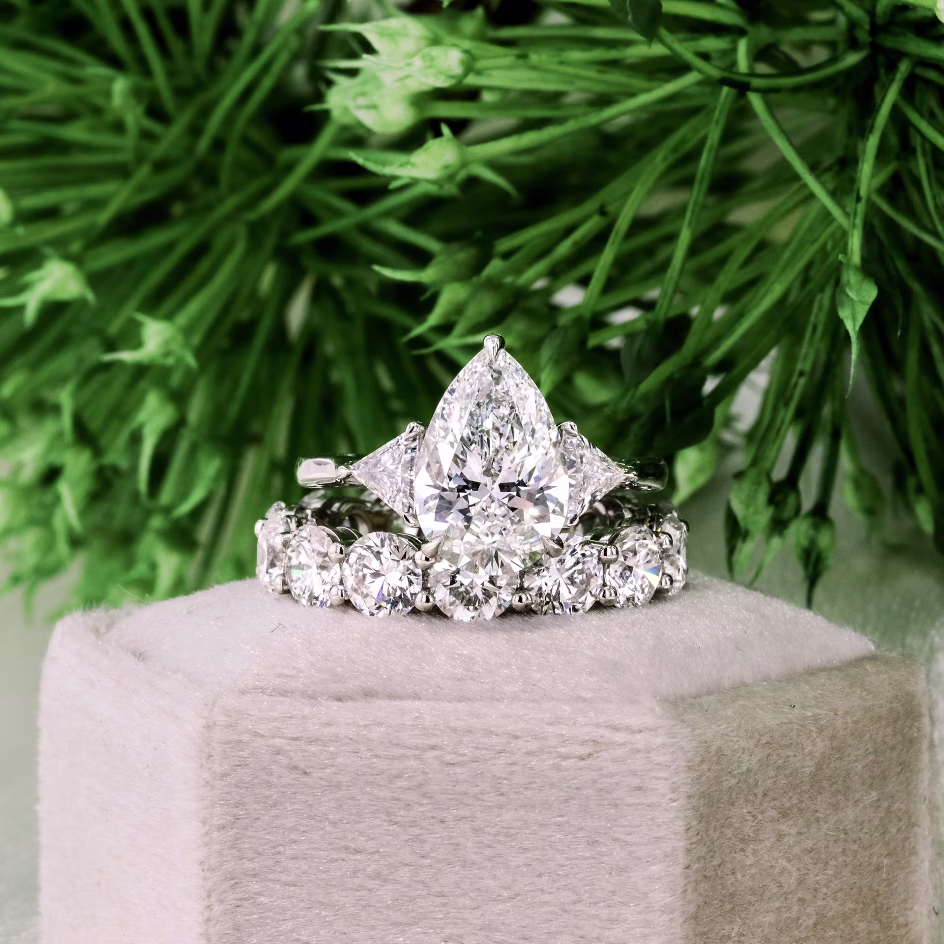 platinum pear and trillion three stone engagement ring with 5ct prong set lab diamond wedding band ada diamonds design ad 496 and ad 081