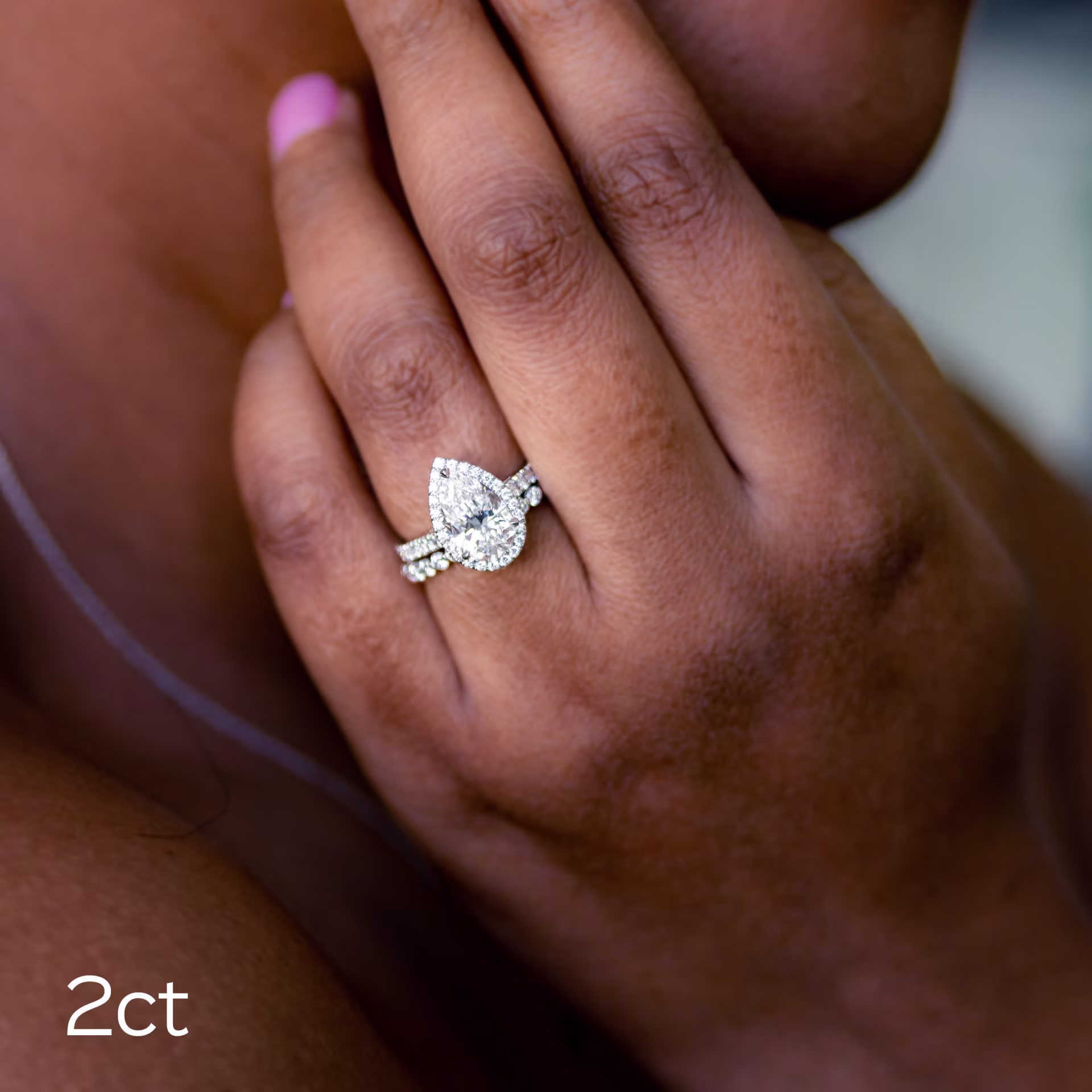 2ct pear lab diamond wedding set featuring halo engagement ring and eternity band in white gold ada diamonds design ad-304 on model