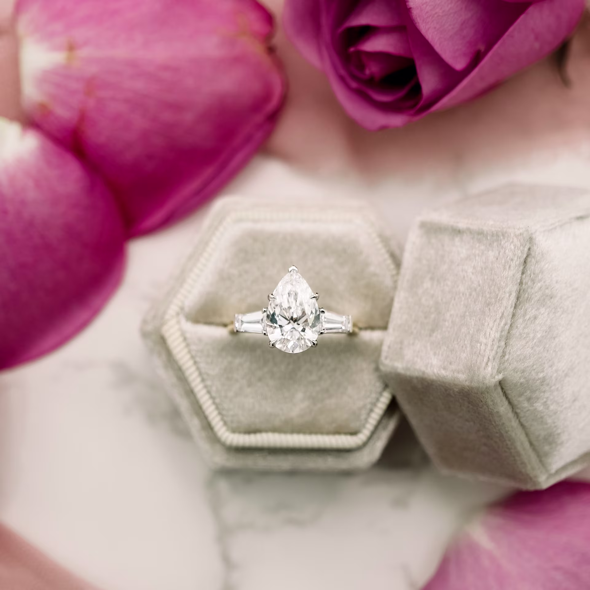 two-tone platinum and yellow gold 3.25 carat pear lab diamond engagement ring with baguette side stones ada diamonds design ad 495 in box