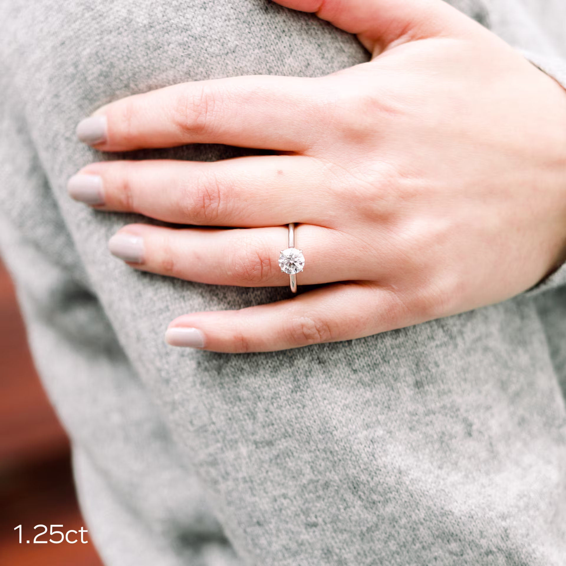 1.25ct round lab diamond in trellis solitaire