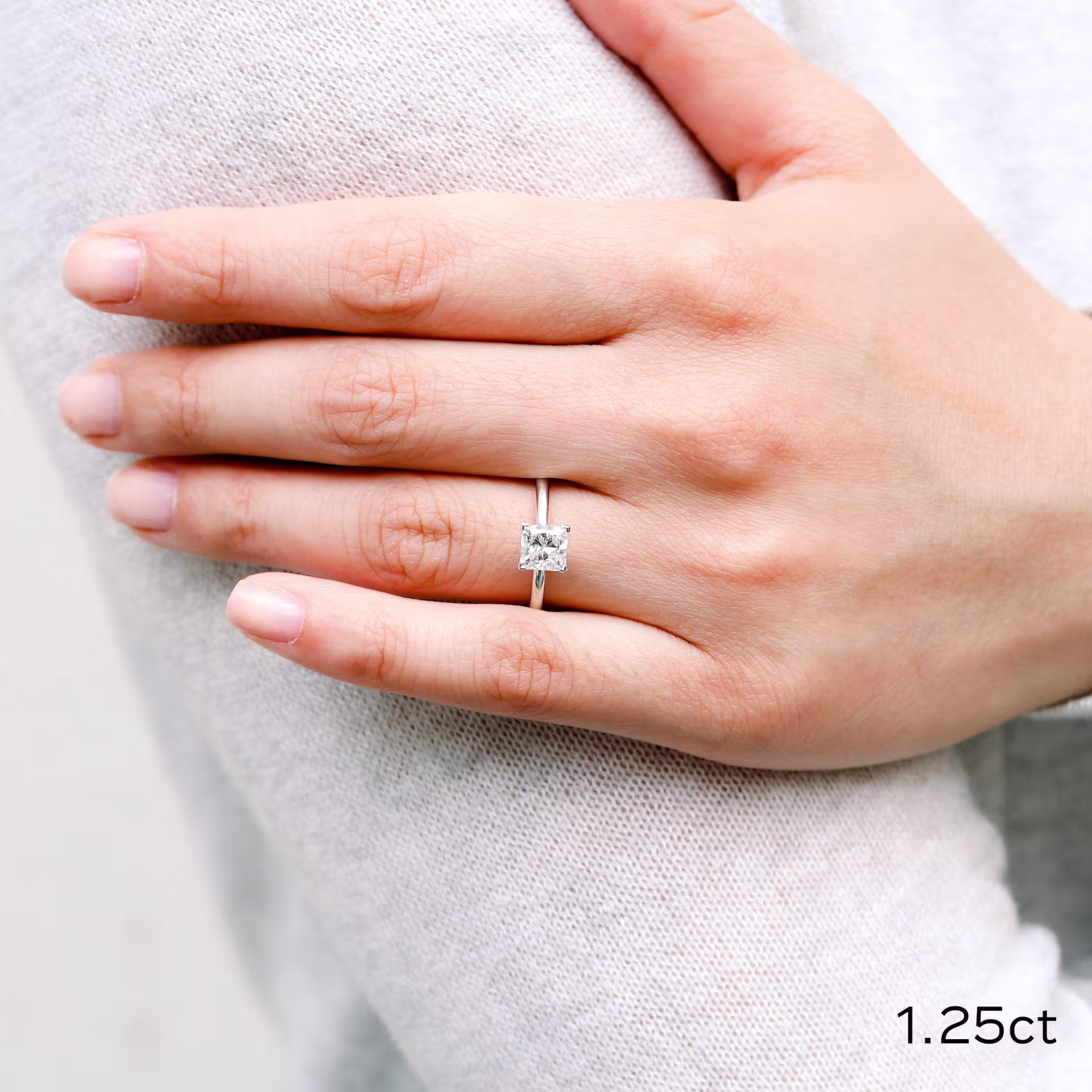 Platinum 1.25 Carat Cushion Cut Man Made Diamond Solitaire Engagement Ring Ada Diamonds Design AD227 on Hand Image