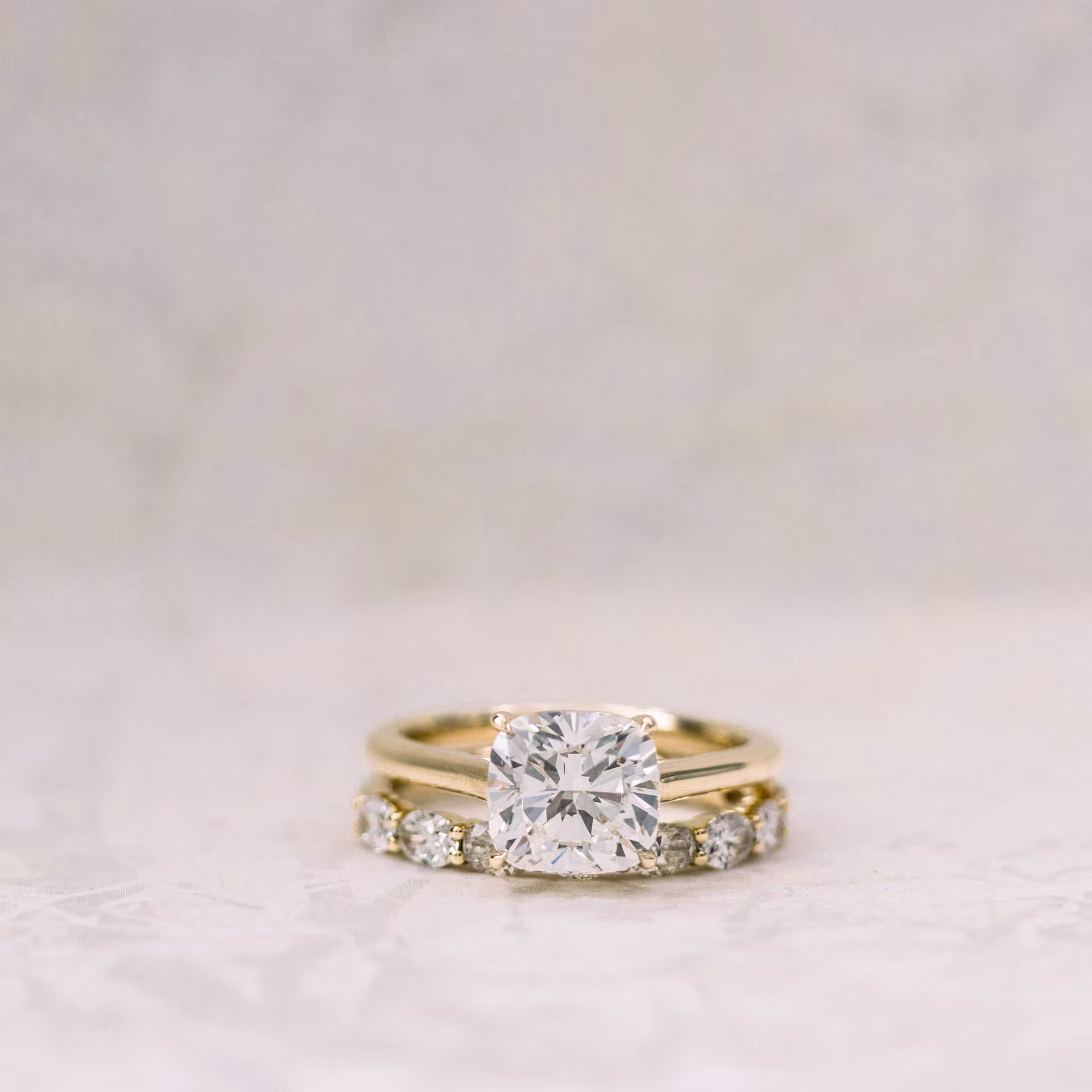 14k Yellow Gold 2.5ct Cushion Cut Solitaire Lab Diamond Ring and Custom Oval Three Quarter Eternity Band Ada Diamonds Design AD-177 and AD-262 Macro