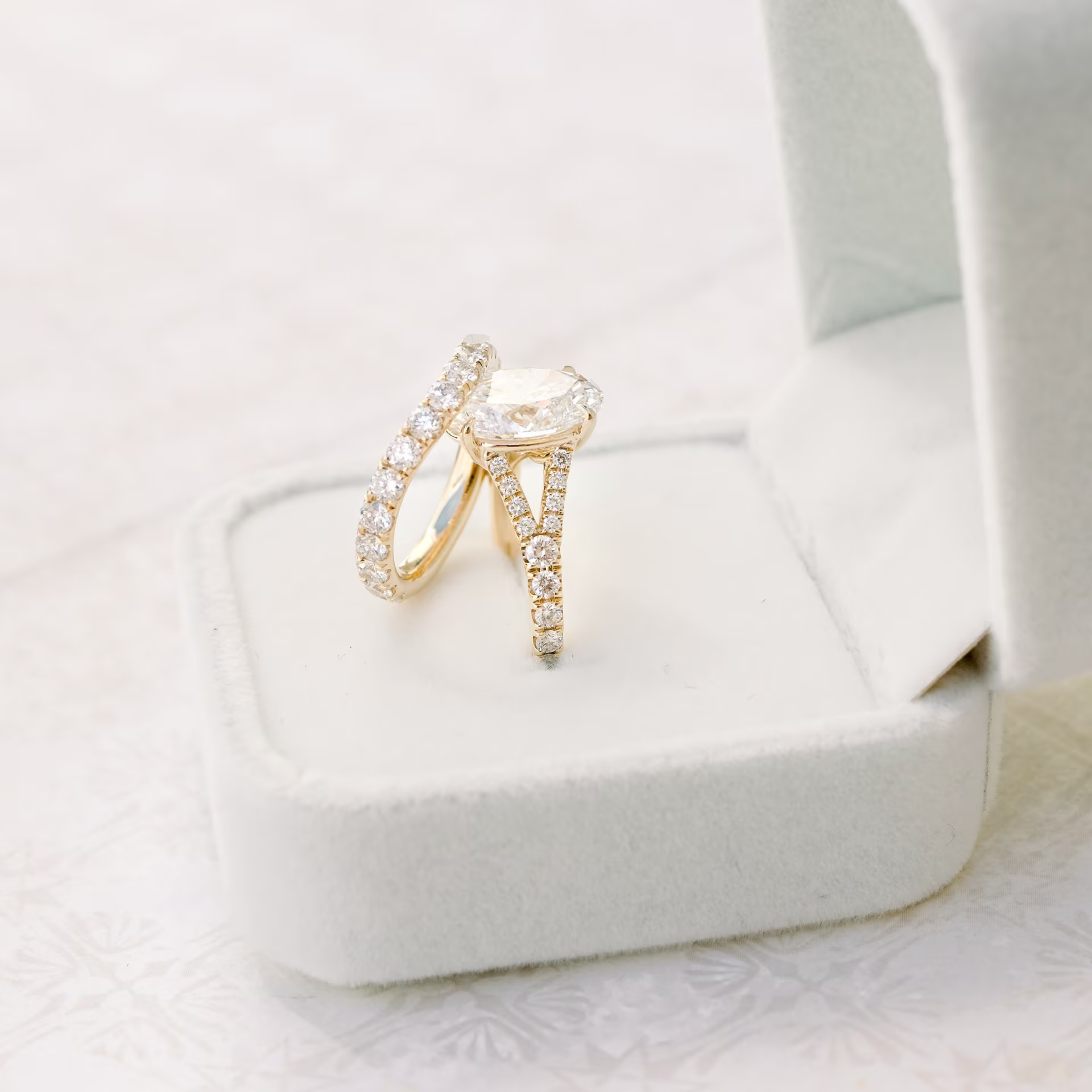 custom 14k yellow gold 3/4 nesting wedding band with oval lab diamond engagement ring ada diamonds design ad262 and ad153