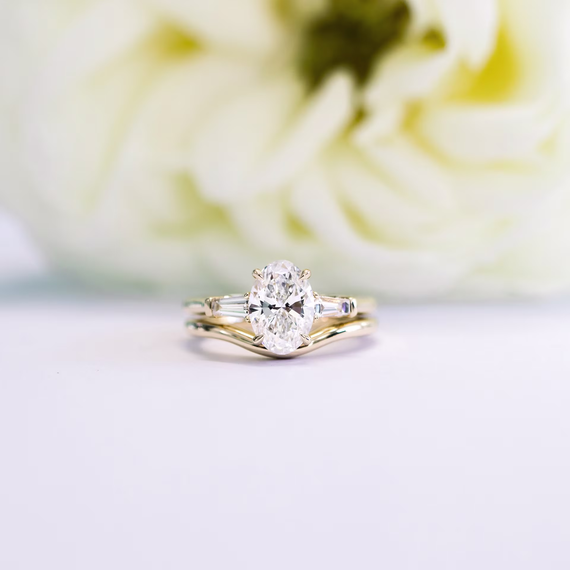 custom contour wedding band with oval and baguette lab diamond engagement ring yellow gold ada diamonds design ad 181 and ad 459