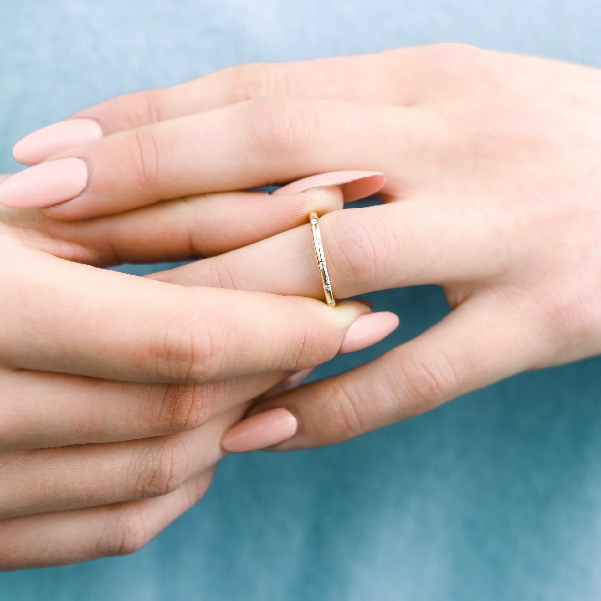 yellow gold custom wedding band with small evenly spaced lab grown diamonds ada diamonds design ad 262 on model