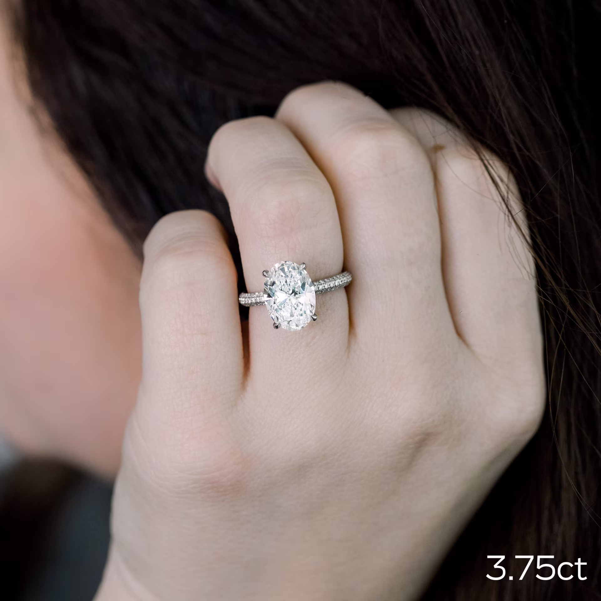 3.75ct oval in three sided pave setting