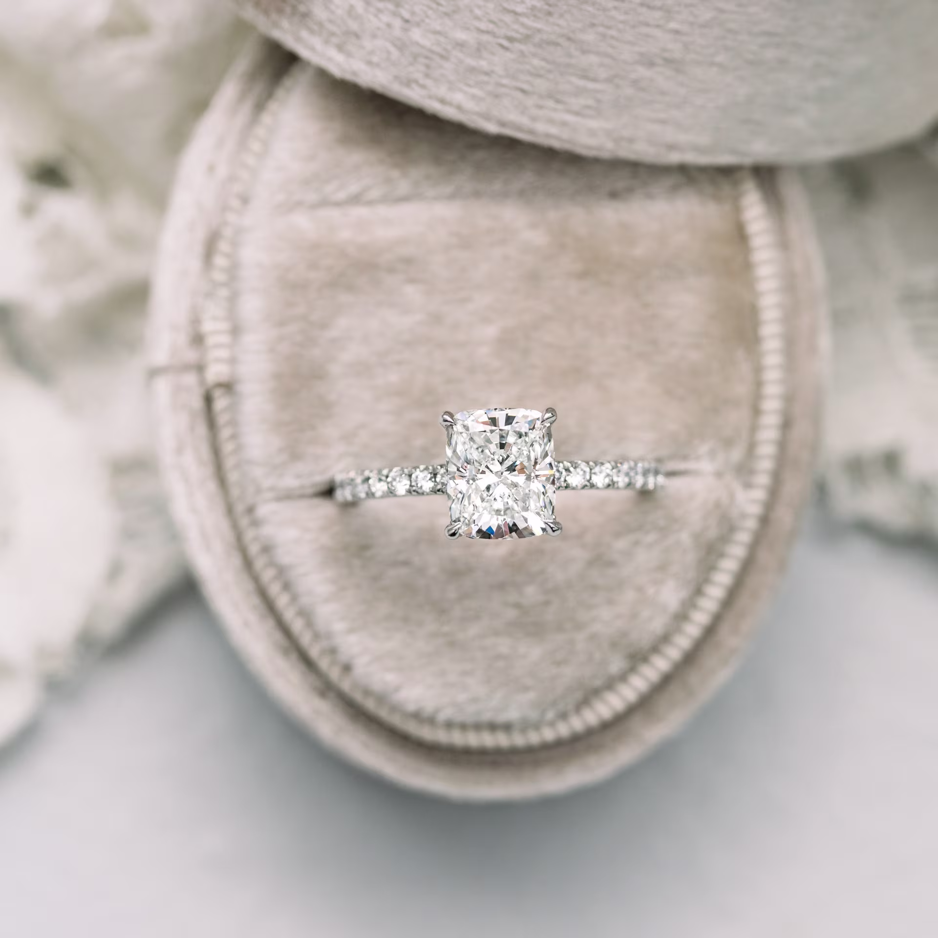 Exceptional Quality 1.75 ctw Lab Diamonds set in Platinum Cushion Petite Four Prong Pavé Diamond Engagement Ring (Main View)