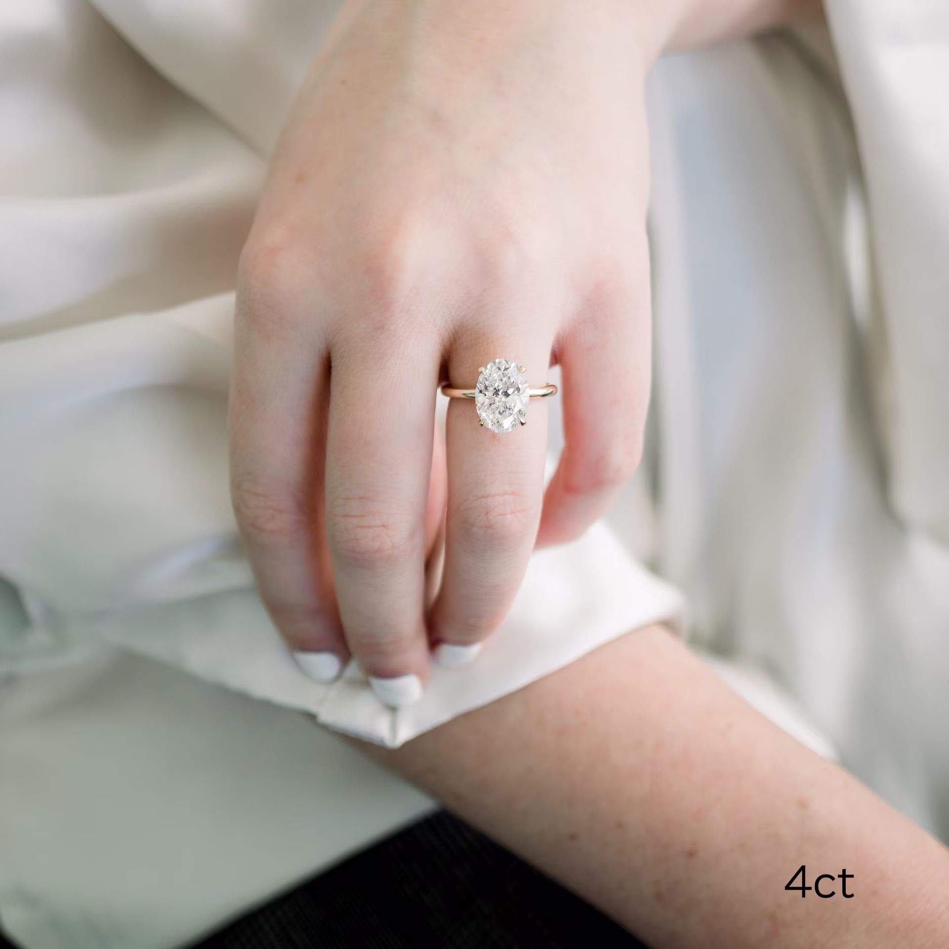 14k yellow gold 4ct Oval Lab Diamond Petite Four Prong Solitaire Engagement Ring Ada Diamonds Design AD-143 on Model