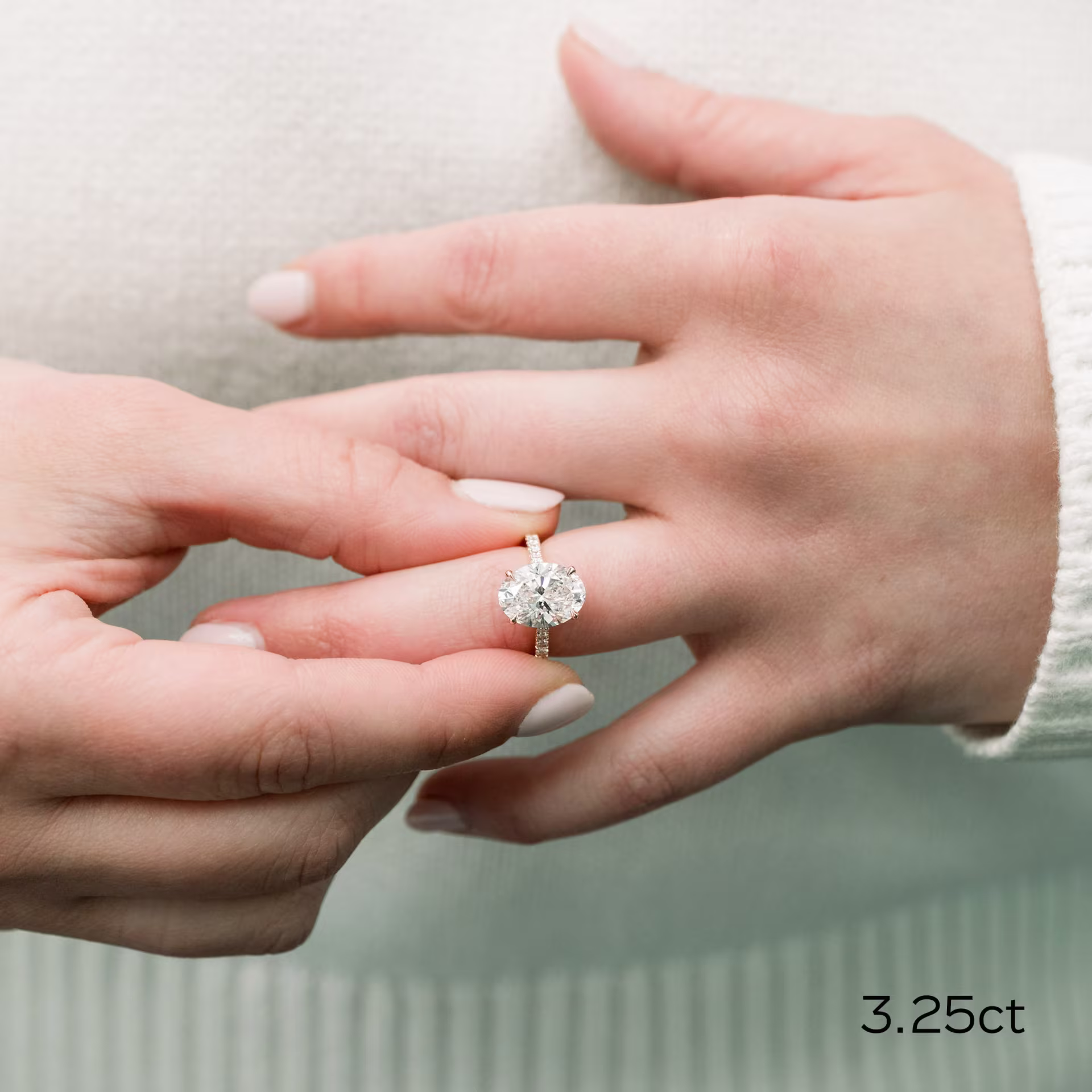 18k rose gold 3.25 carat oval cathedral pavé man made diamond engagement ring on model ada diamonds design ad190