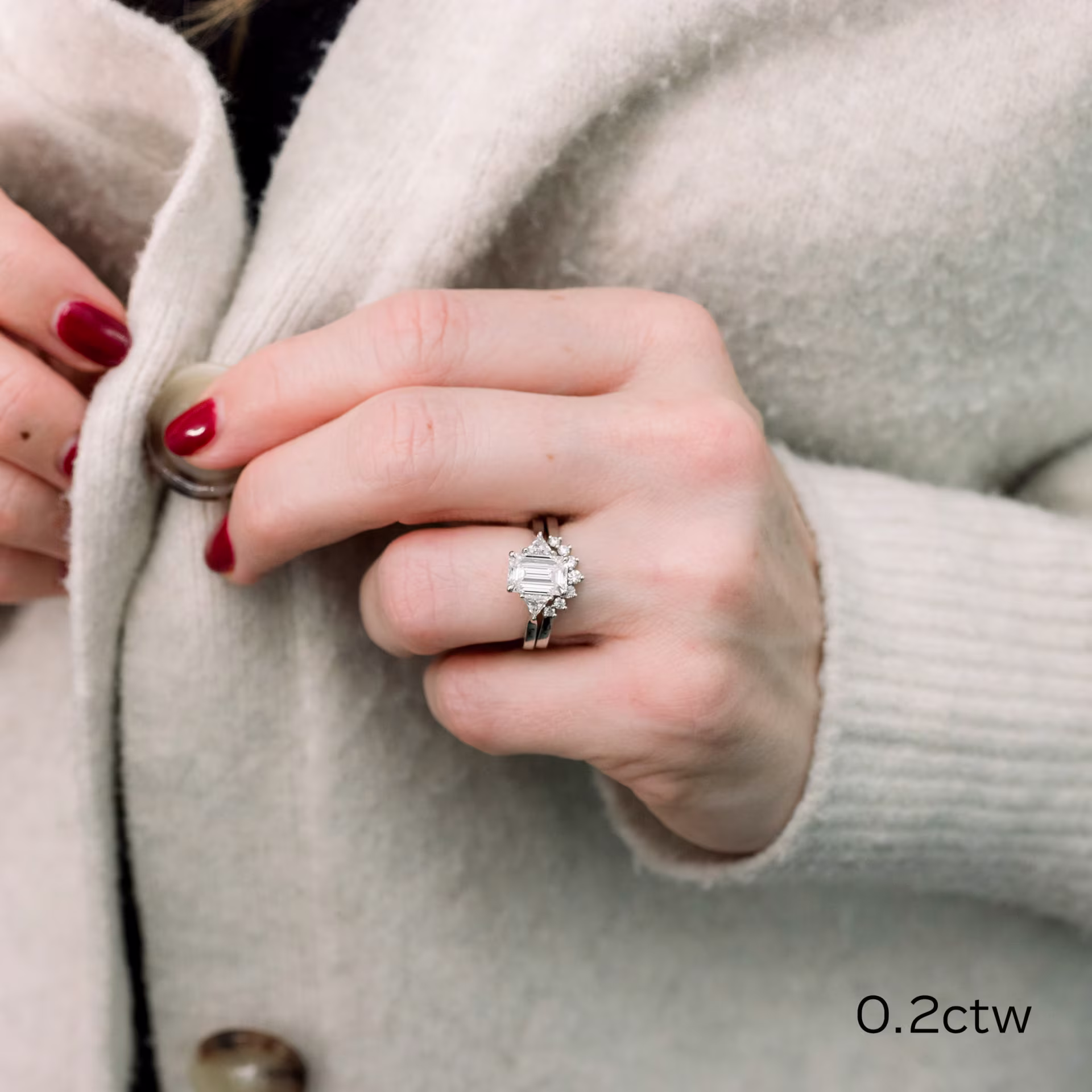 platinum lab diamond wedding set with nesting wedding band and emerald cut and trillion three stone engagement ring ada diamonds design ad 258 and ad 466 on model