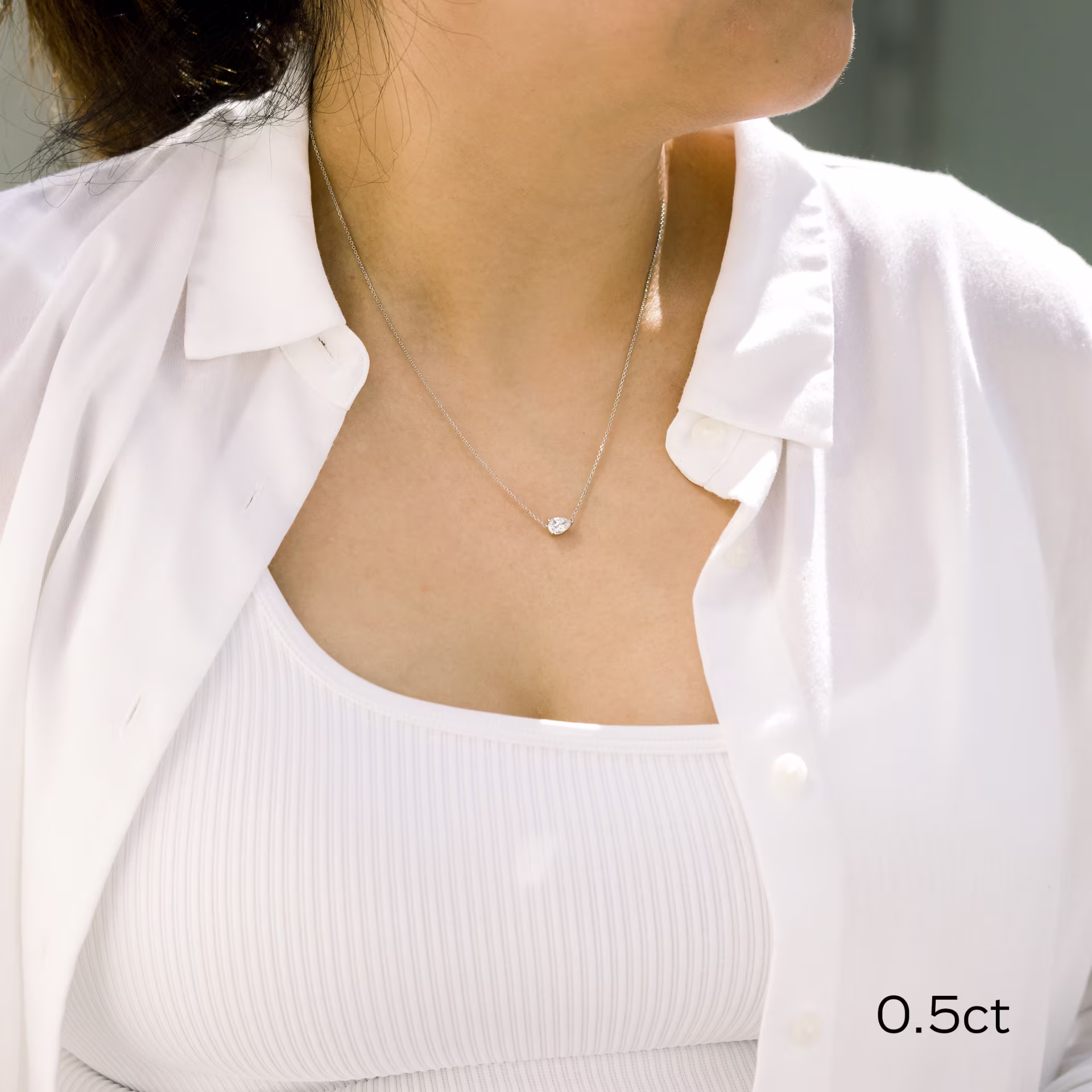 half carat white gold pear pendant on model