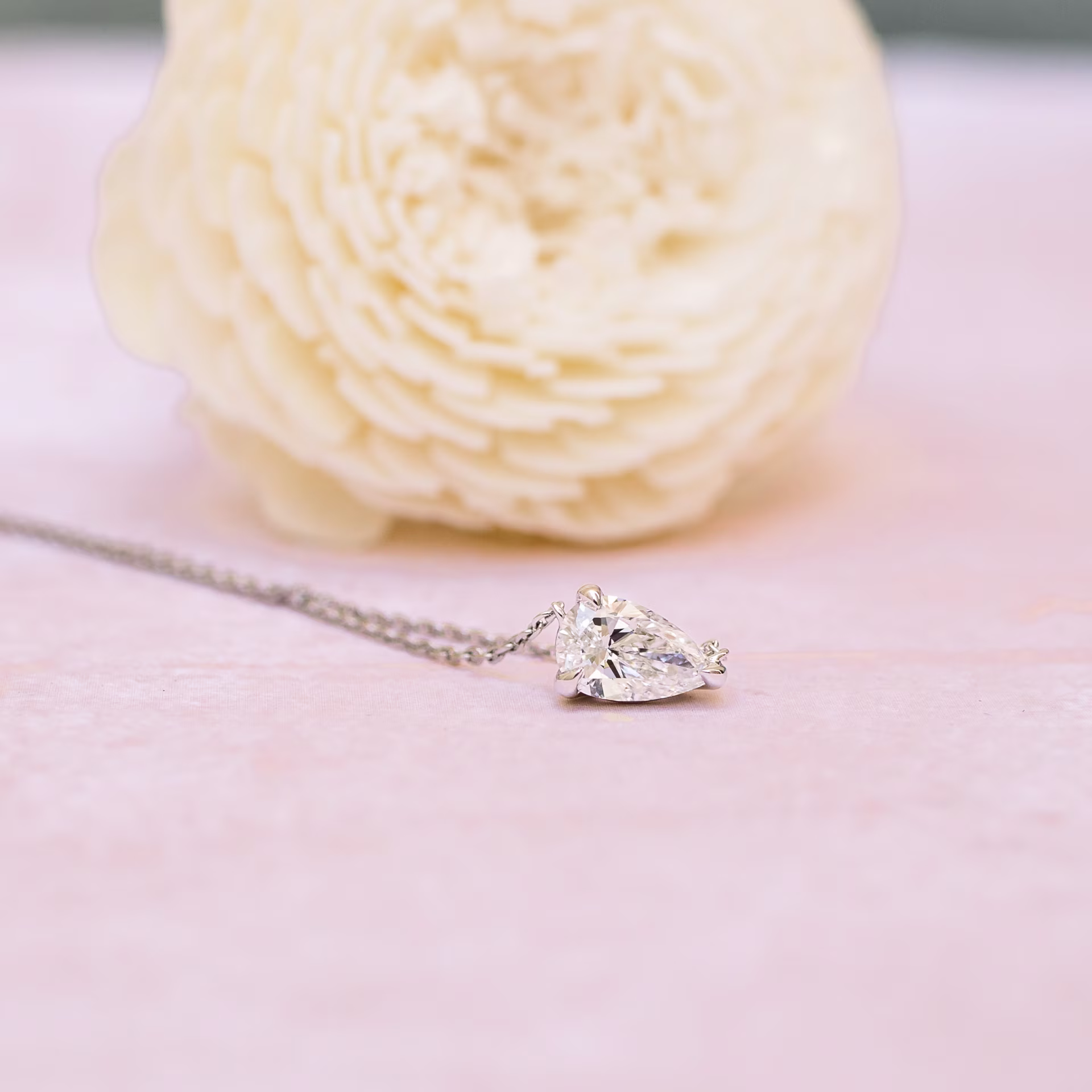 Exceptional Quality 0.7 Carat Man Made Diamonds set in 14k White Gold Floating Pear Pendant (Main View)