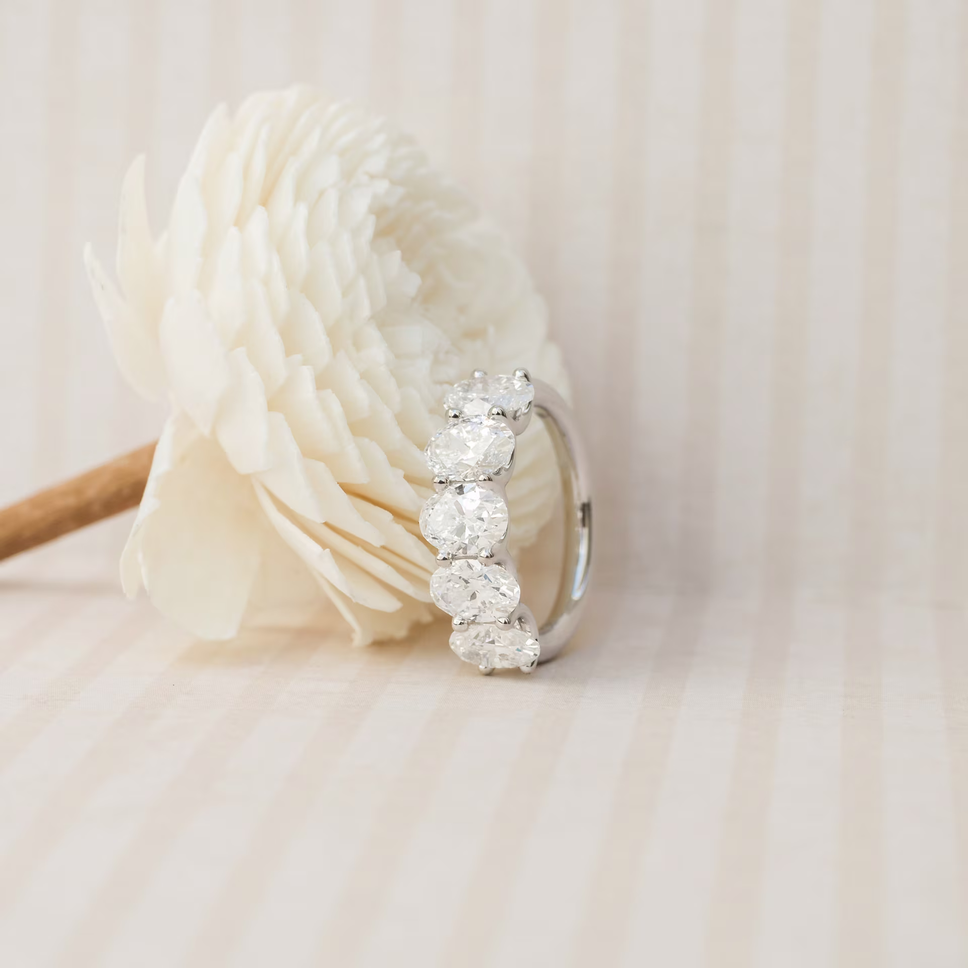 18 Karat White Gold 3.5ctw Oval Diamond French U Five Stone Band in 18k White Gold featuring 3.5 ctw Diamonds (Side View)