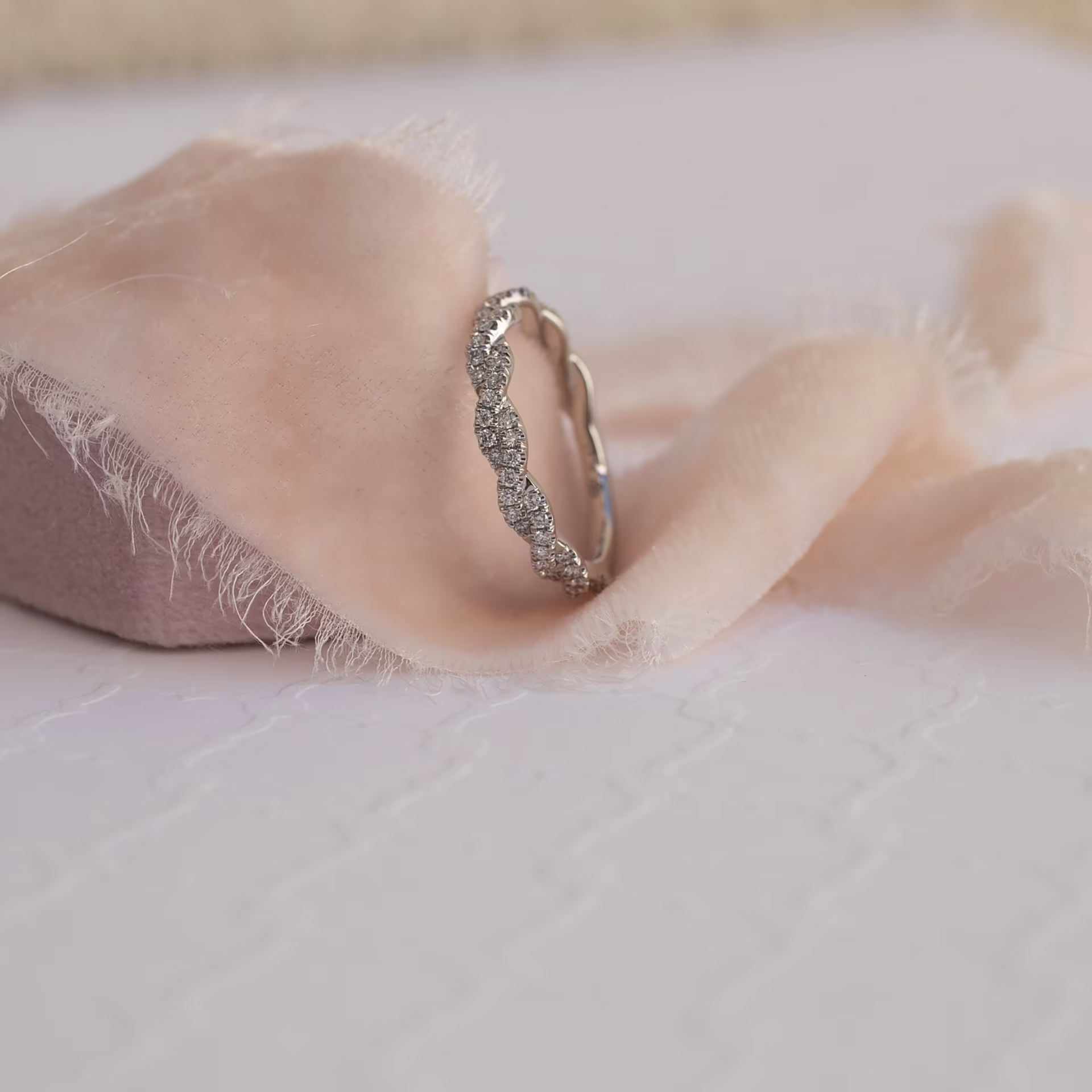 Platinum Infinity Twisting Full Three Quarter Band in Platinum 0.3ctw featuring Exceptional Quality 0.3 Carat Round Diamonds (Side View)