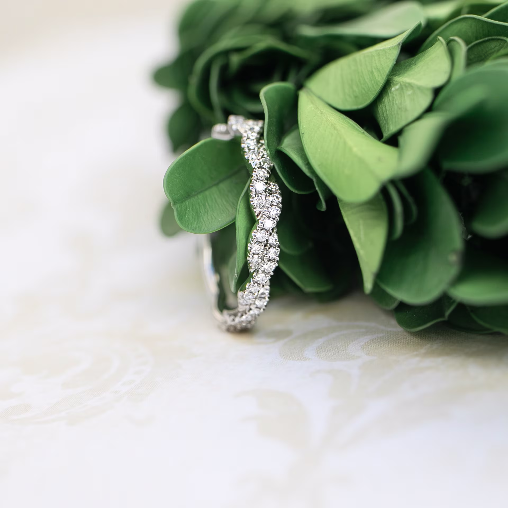 Platinum Infinity Twisting Full Three Quarter Band featuring 0.3 Carat Round Lab Diamonds (Side View)