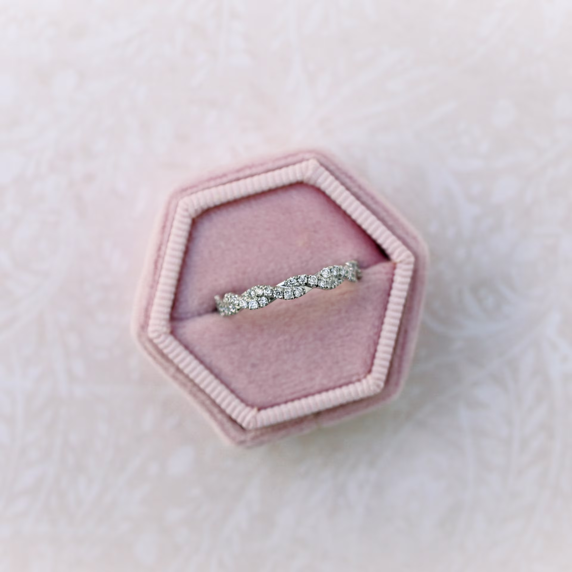 18k White Gold Infinity Twisting Full Half Band in 18k White Gold 0.25ctw featuring 0.25 ctw Round Diamonds (Main View)