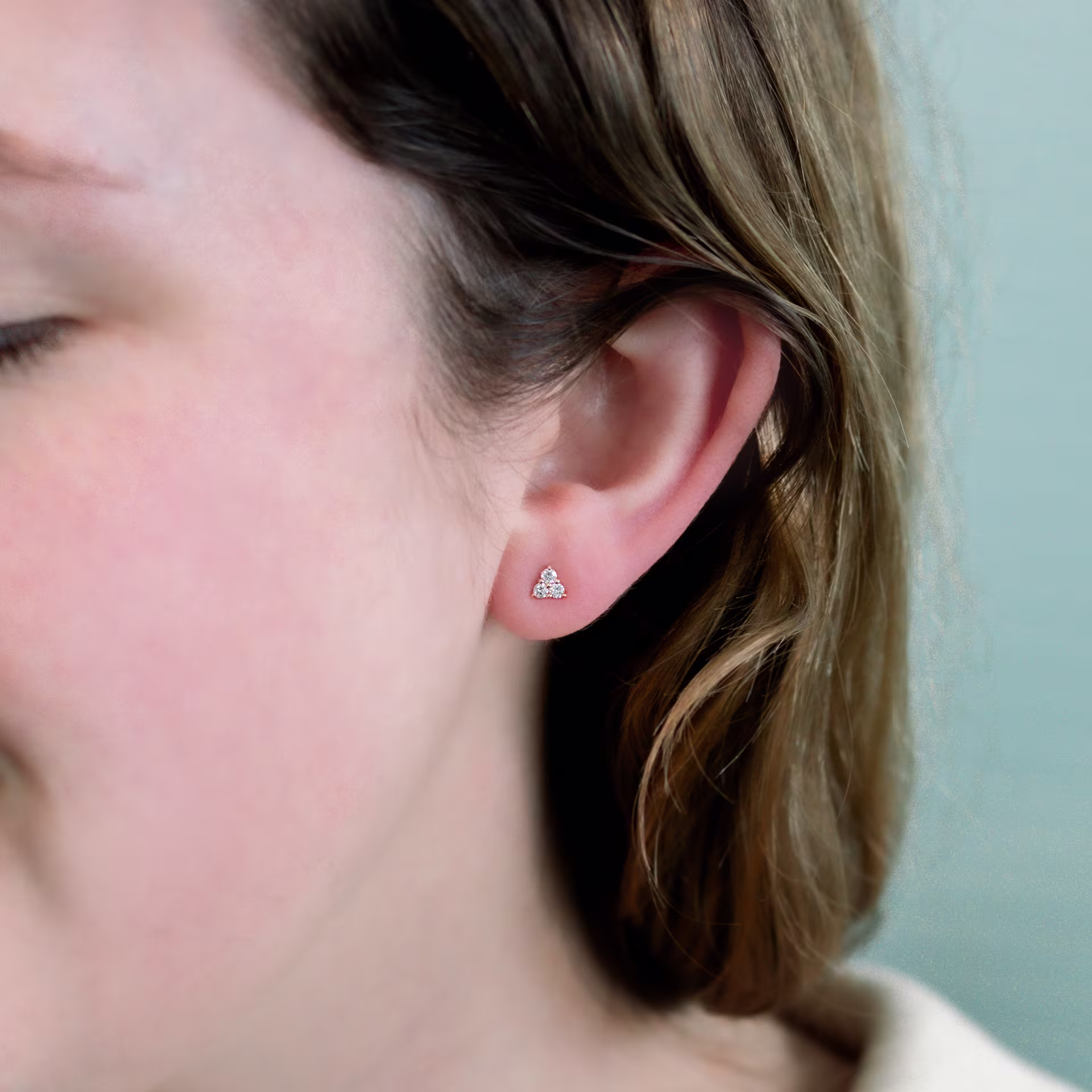 14k Yellow Gold 0.18ctw Three Stone Diamond Earrings in 14k Yellow Gold featuring Exceptional Quality 0.18 Carat Round Brilliant Diamonds (Main View)