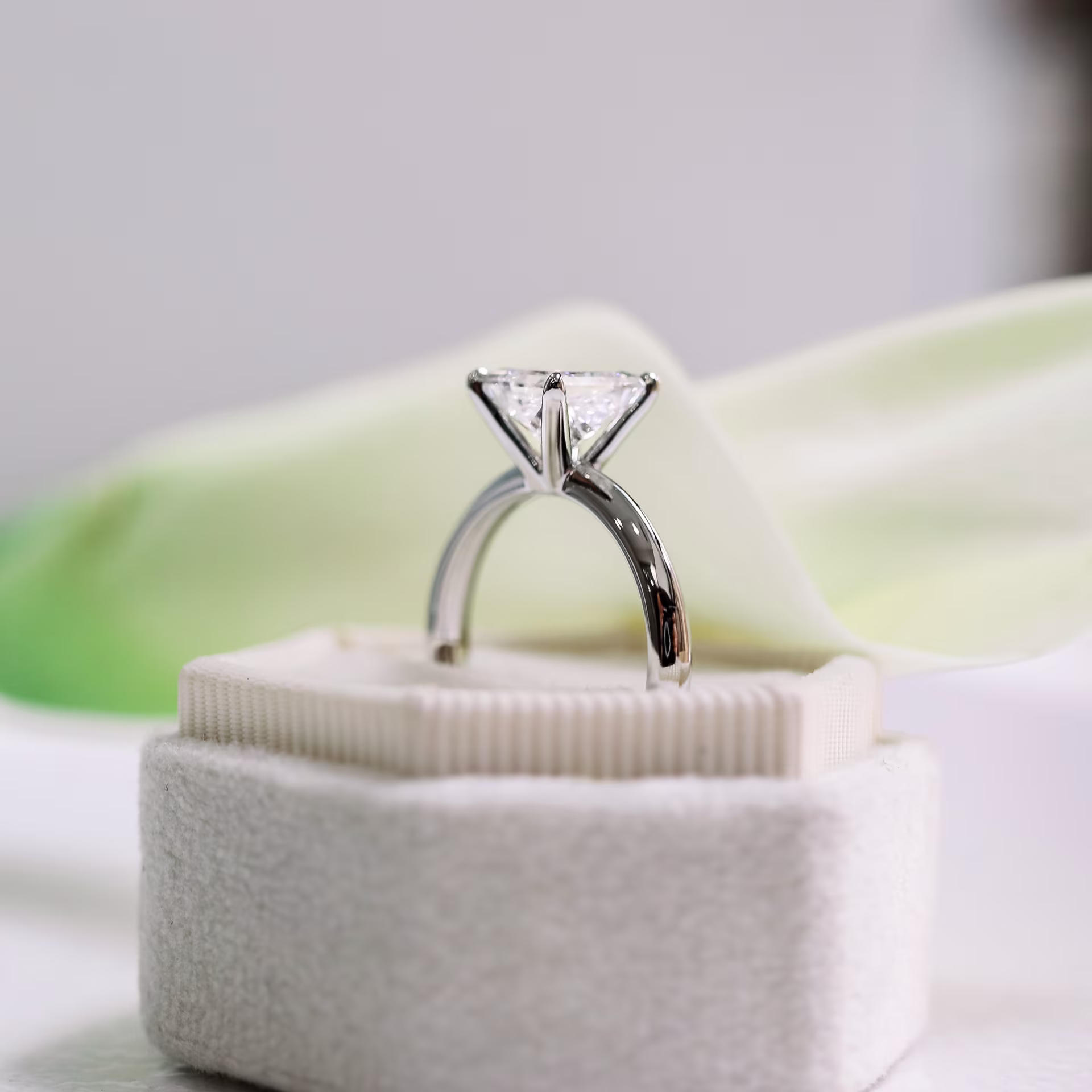 Platinum Princess Classic Four Prong Solitaire Diamond Engagement Ring featuring 1.5 Carat Man Made Diamonds (Side View)