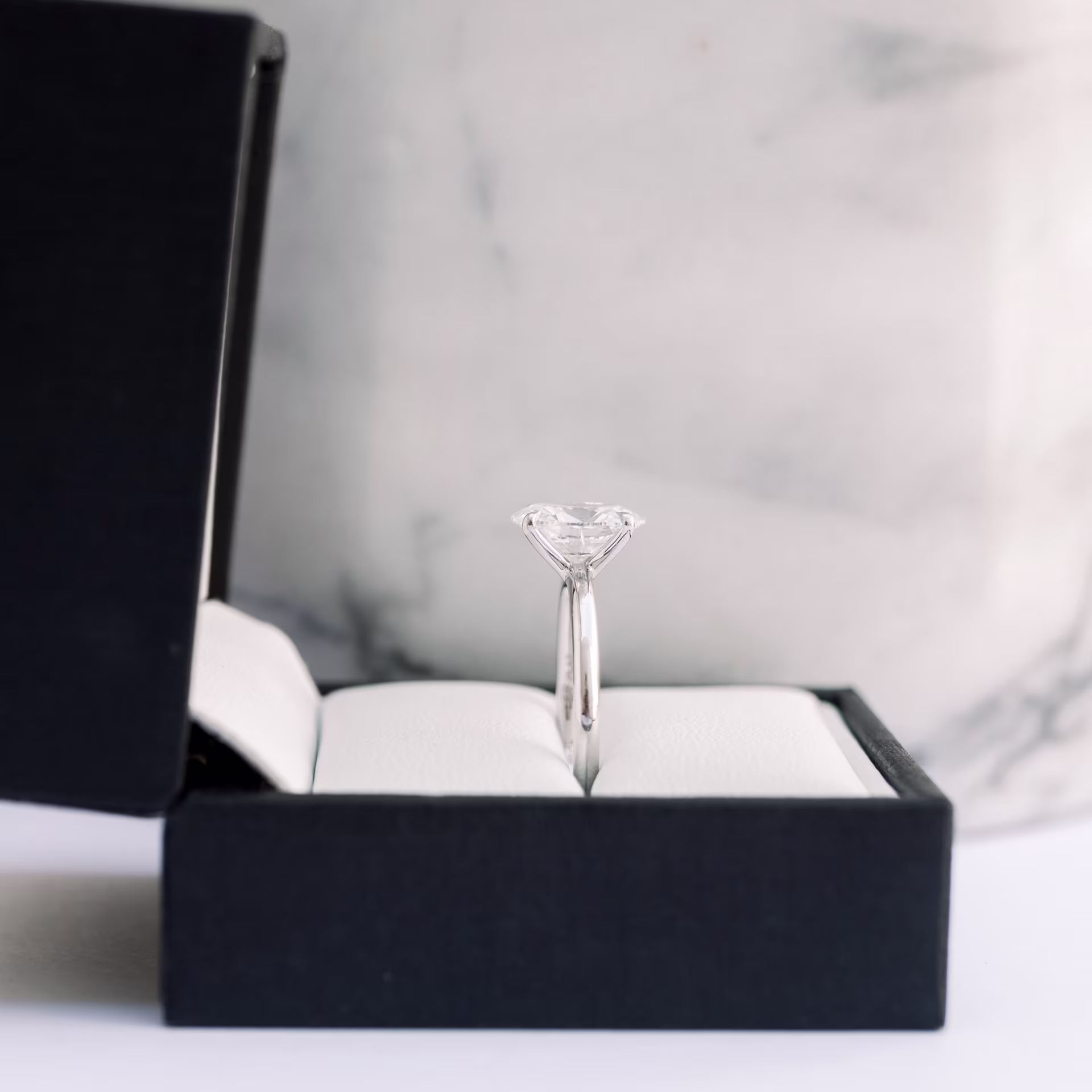 Platinum Oval Classic Four Prong Solitaire Diamond Engagement Ring featuring 1.75 Carat Man Made Diamonds (Side View)