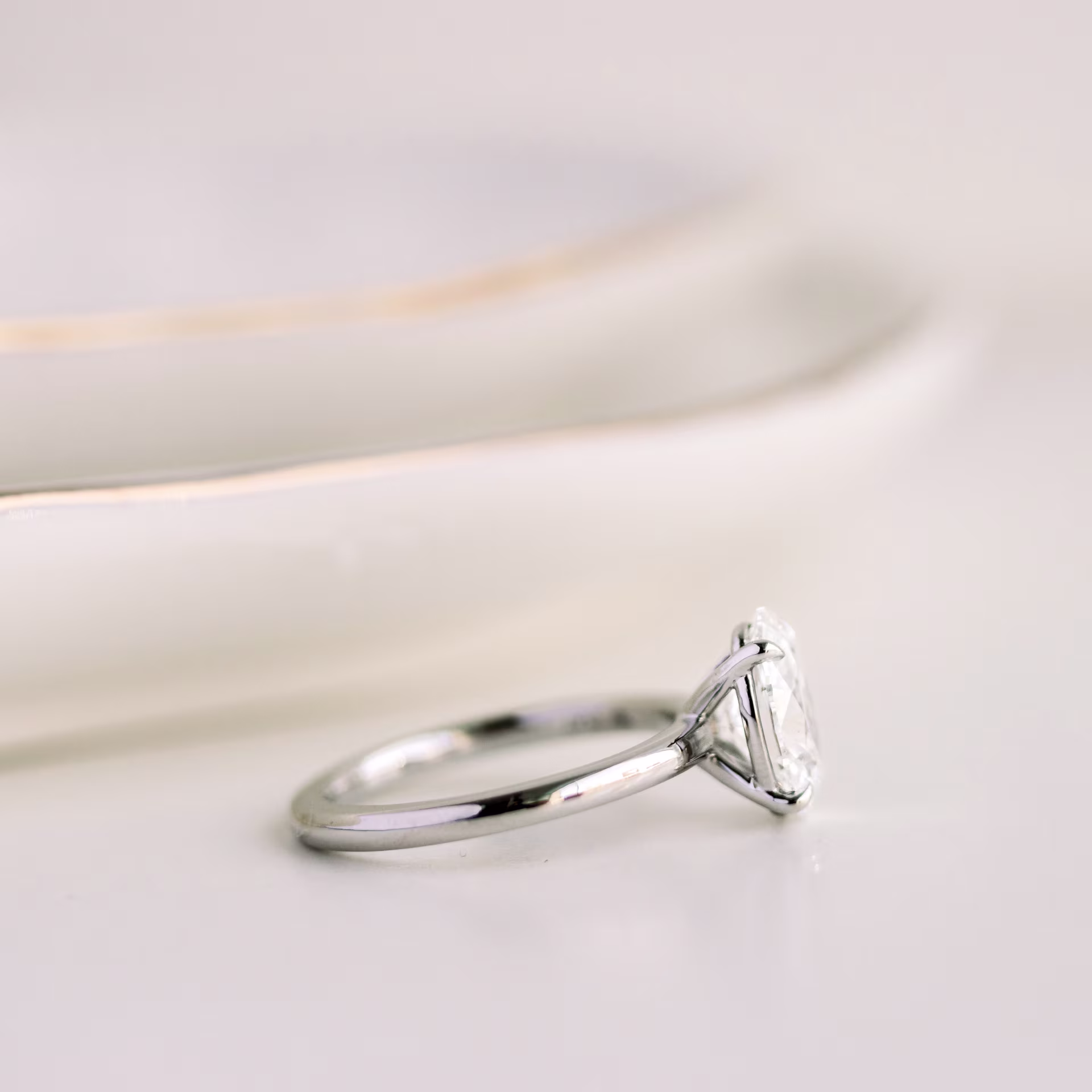 2.0 Carat Lab Diamonds set in Platinum Oval Petite Four Prong Solitaire Diamond Engagement Ring (Side View)