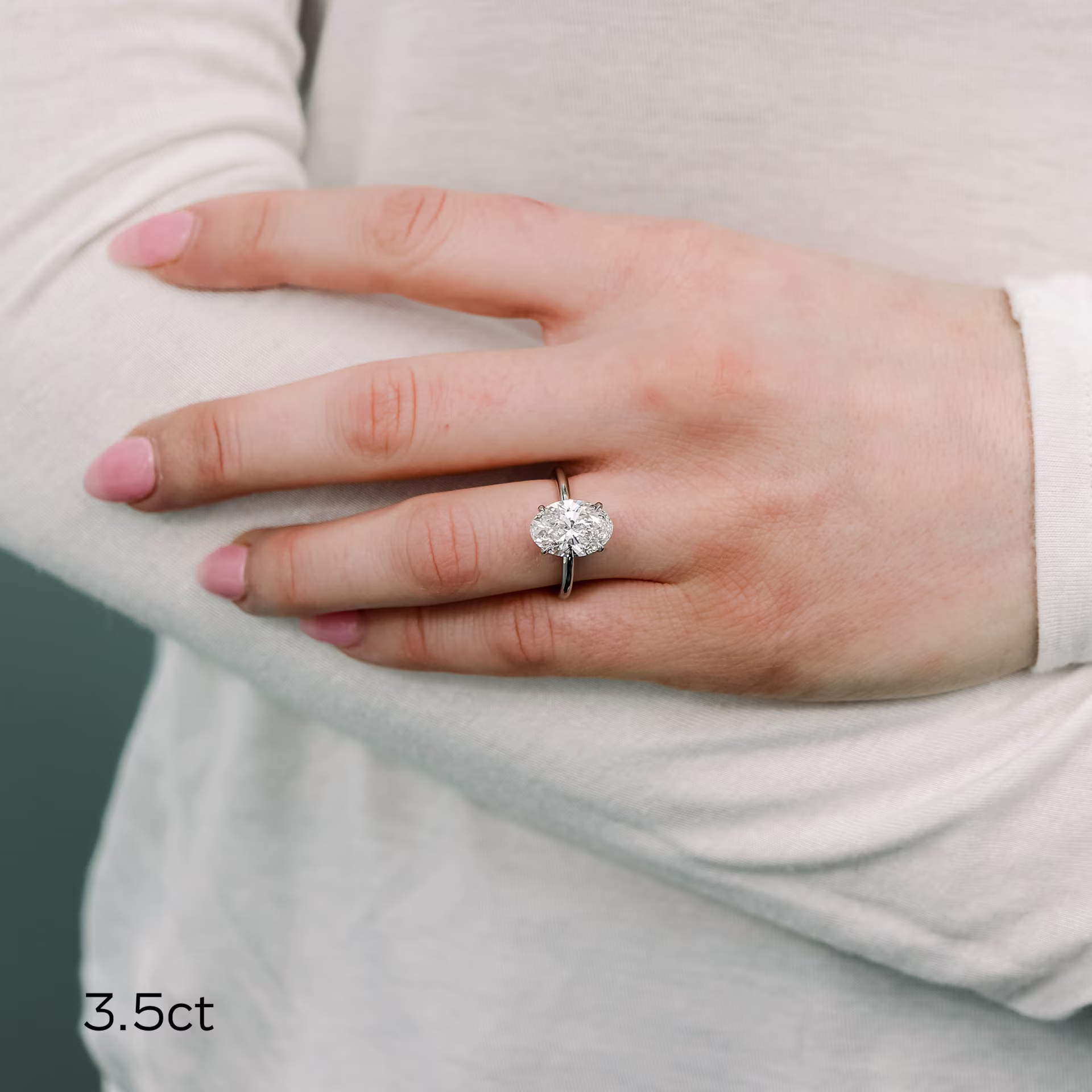 Platinum Oval Petite Four Prong Solitaire Diamond Engagement Ring featuring 3.5 ct Diamonds (Main View)