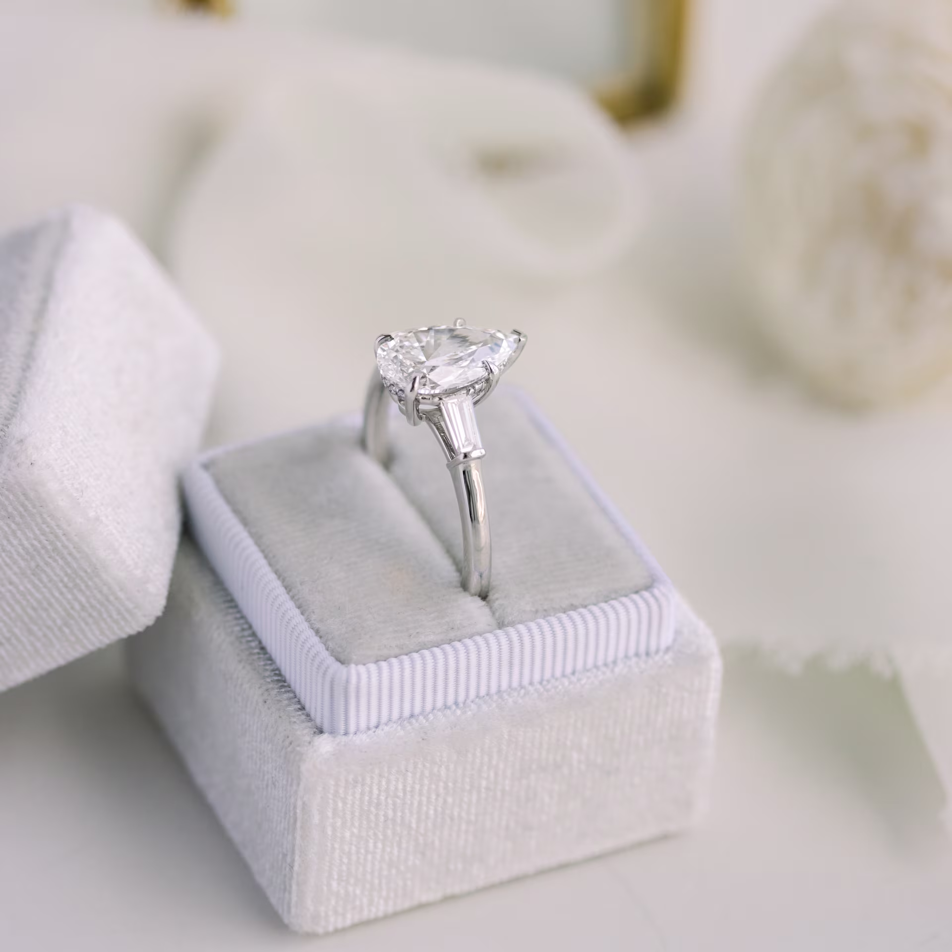 High Quality 3.0 Carat Diamonds set in Platinum Pear and Baguette Setting (Side View)