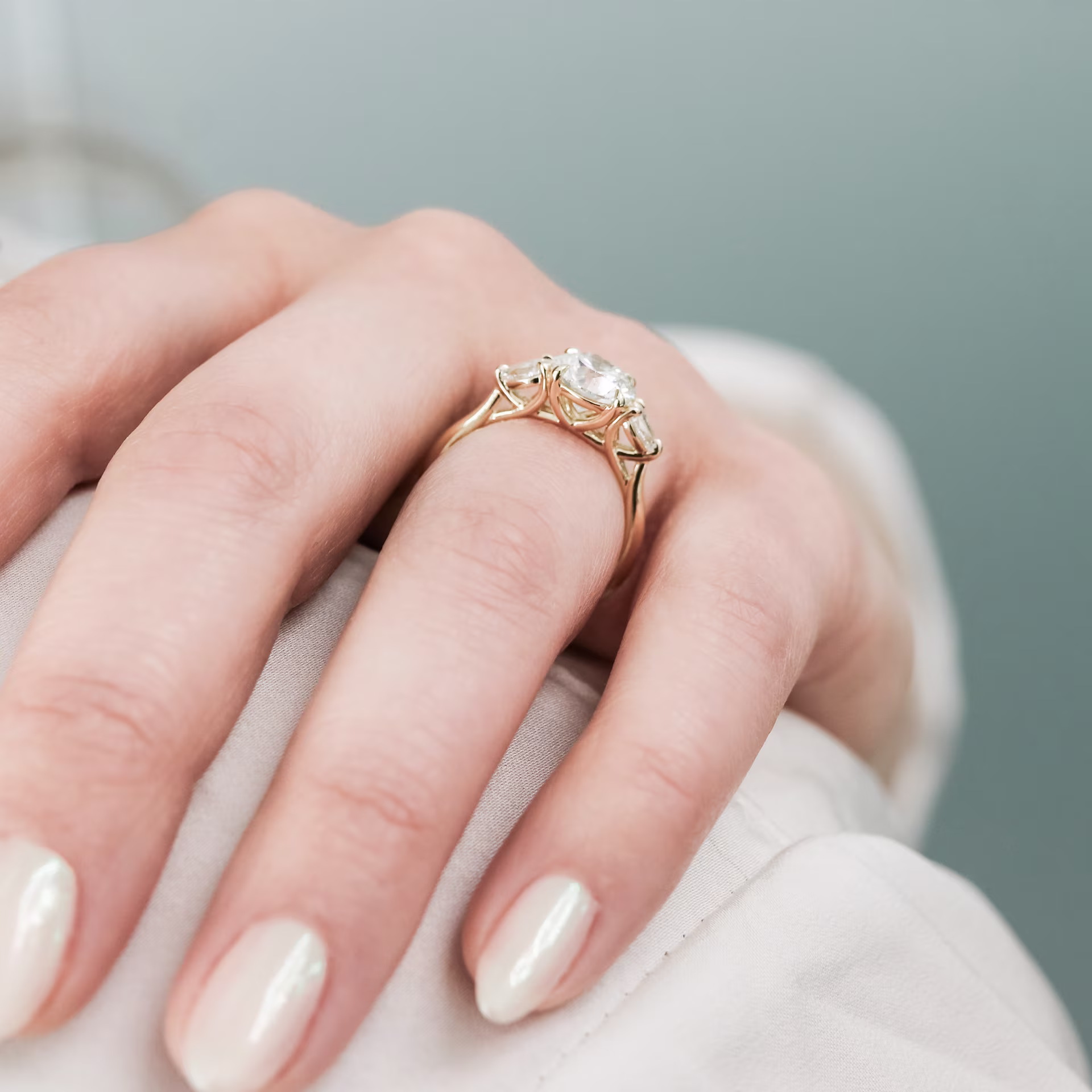 Yellow Gold Round and Pear Diamond Engagement Ring featuring 1.5 ct Lab Diamonds (Profile View)
