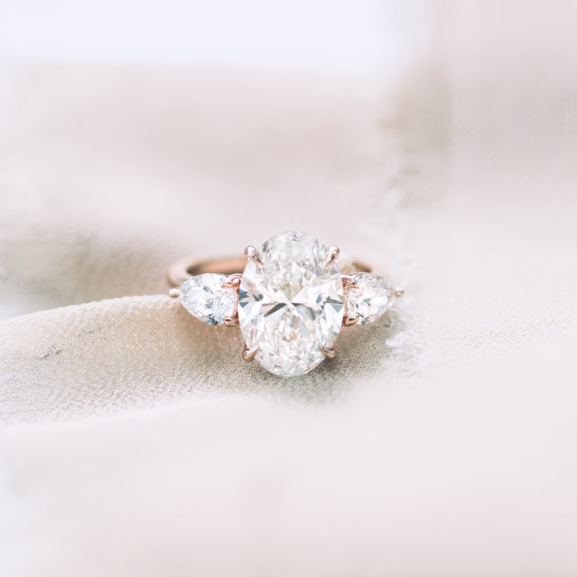 Rose Gold Oval and Pear Diamond Engagement Ring featuring Hand Selected 4.25 Carat Lab Diamonds (Main View)
