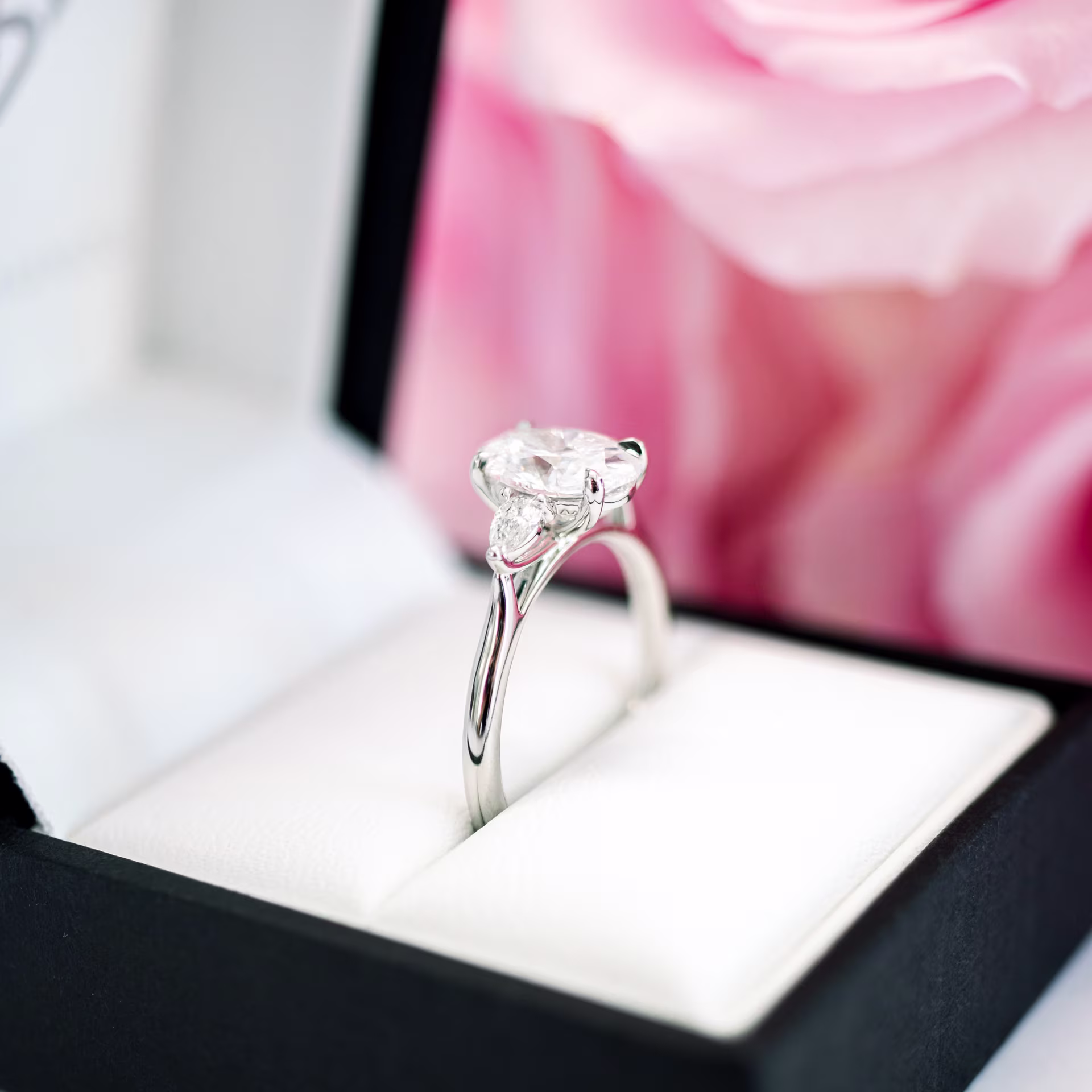 High Quality 1.75 ct Lab Grown Diamonds set in Platinum Oval and Pear Diamond Engagement Ring (Profile View)