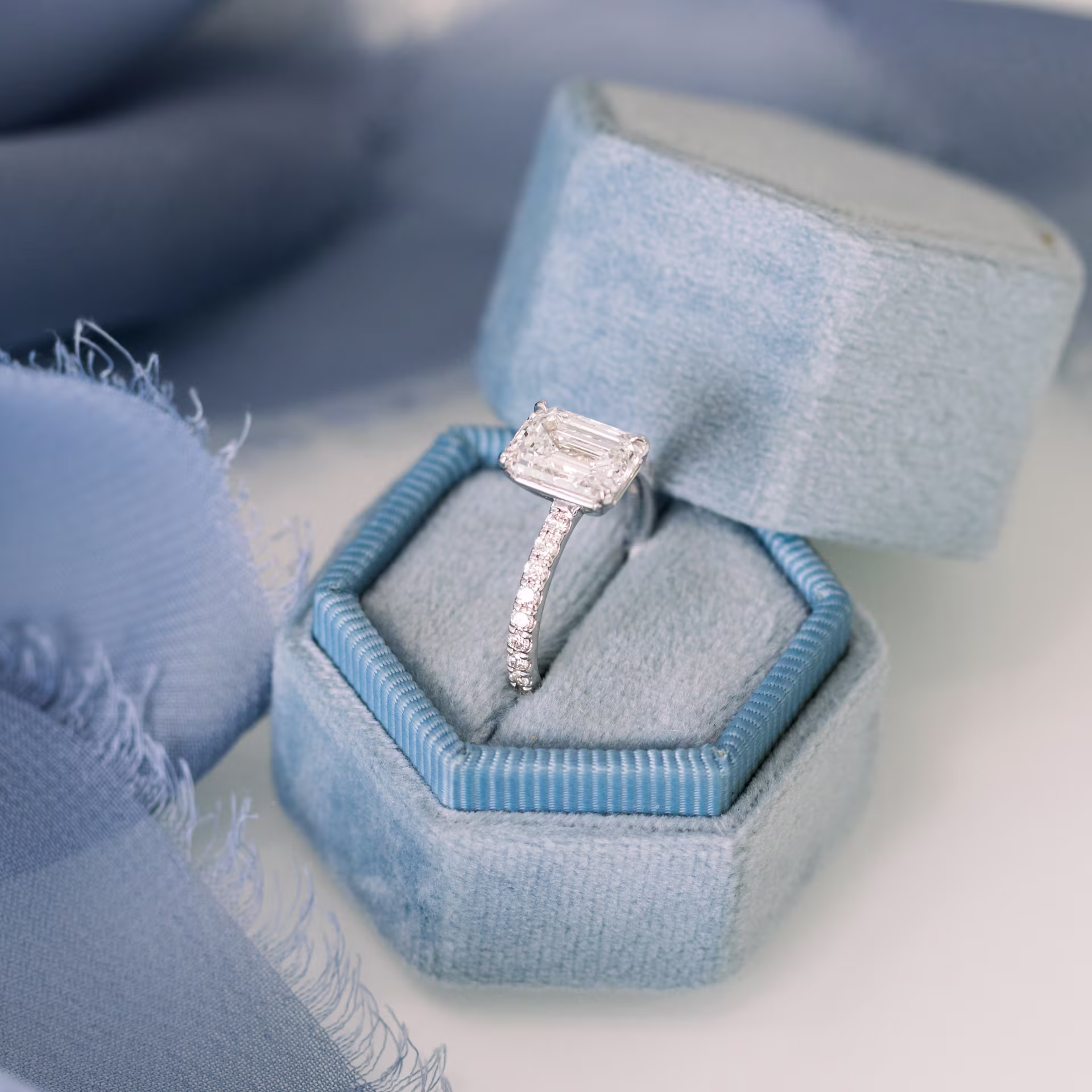 Platinum Emerald Petite Four Prong Pavé Setting featuring 2.0 ctw Lab Created Diamonds (Profile View)