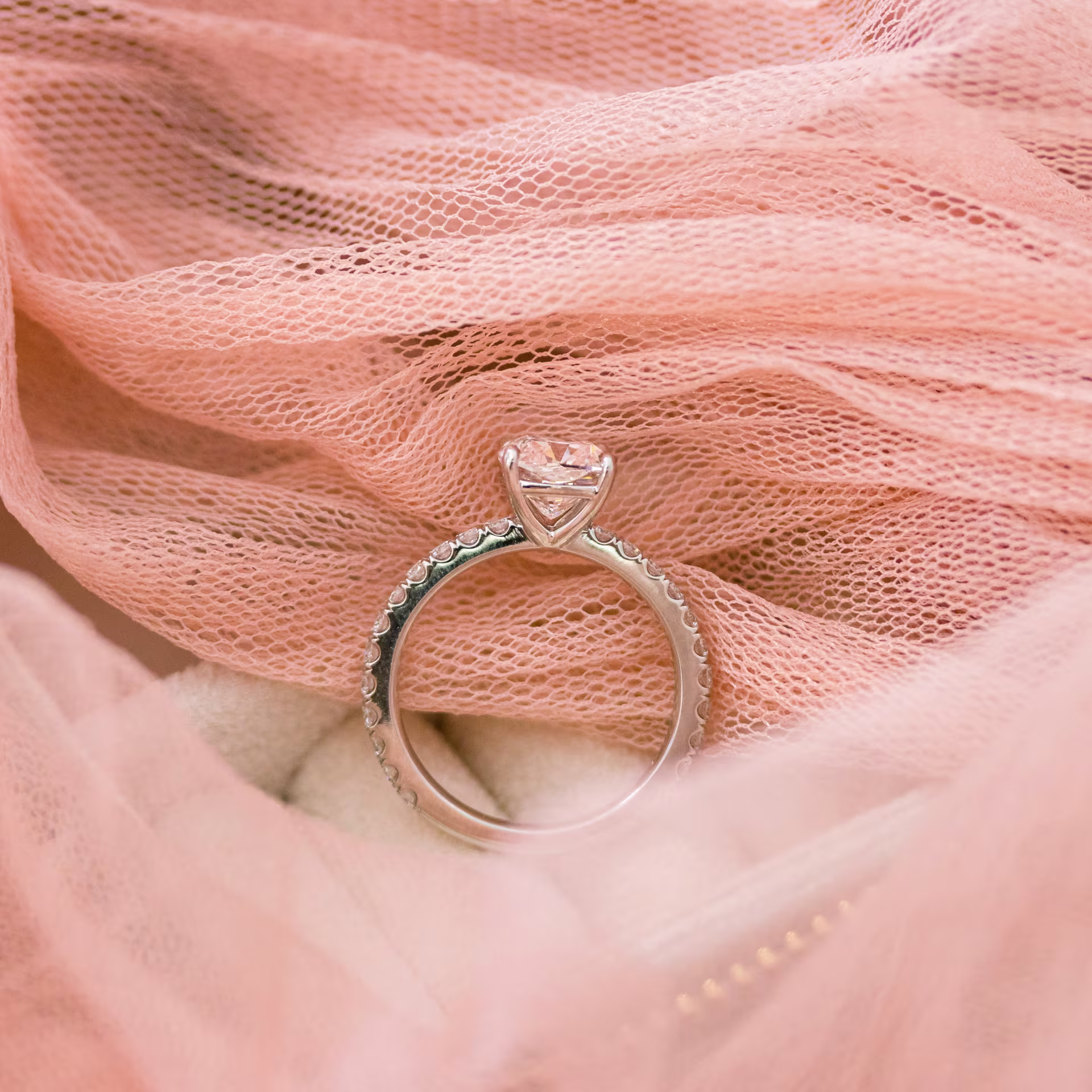 High Quality 2.0 ctw Lab Grown Diamonds Cushion Petite Four Prong Pavé Diamond Engagement Ring in Platinum (Profile View)