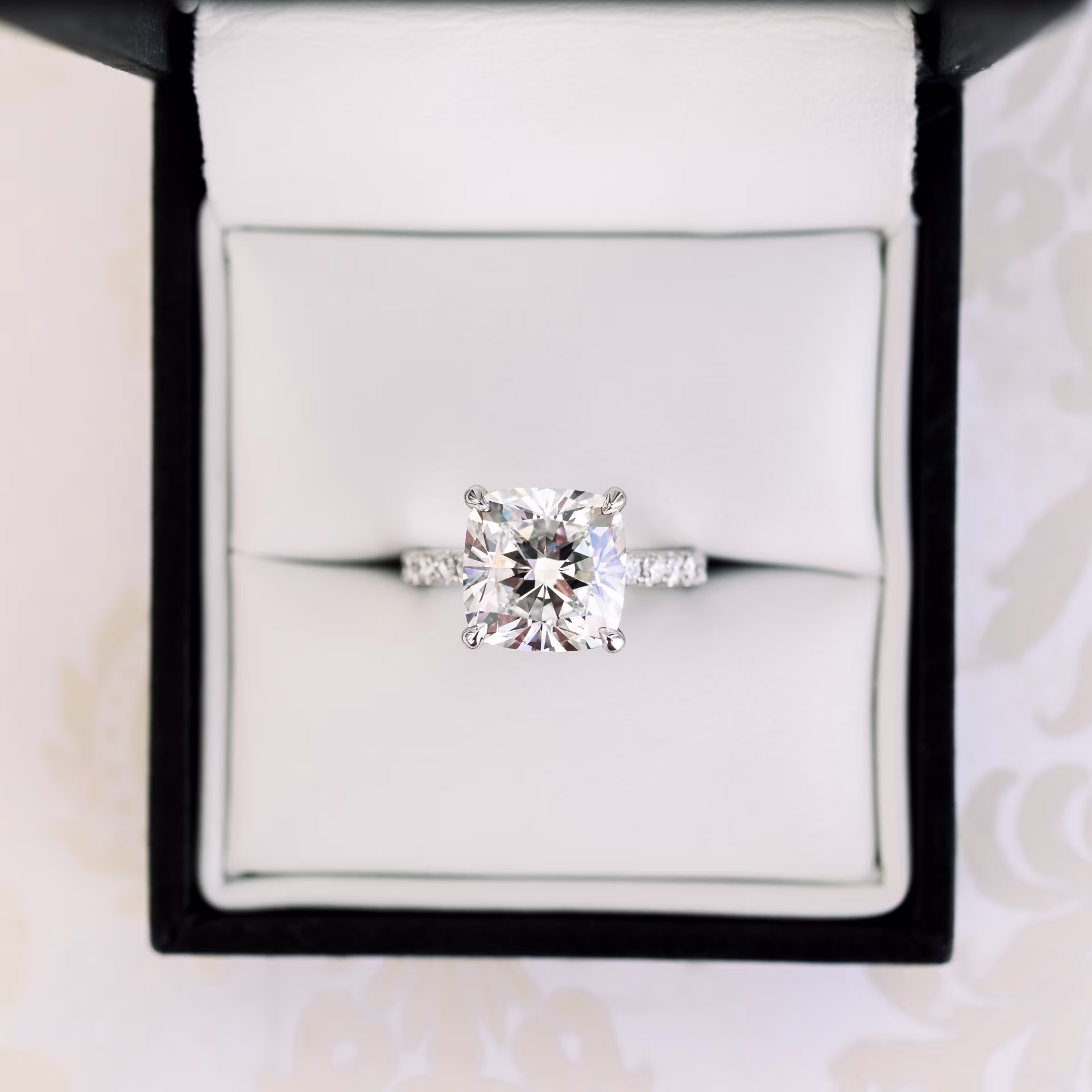 3.5 Carat Synthetic Diamonds set in Platinum Cushion Petite Four Prong Pavé Diamond Engagement Ring (Main View)