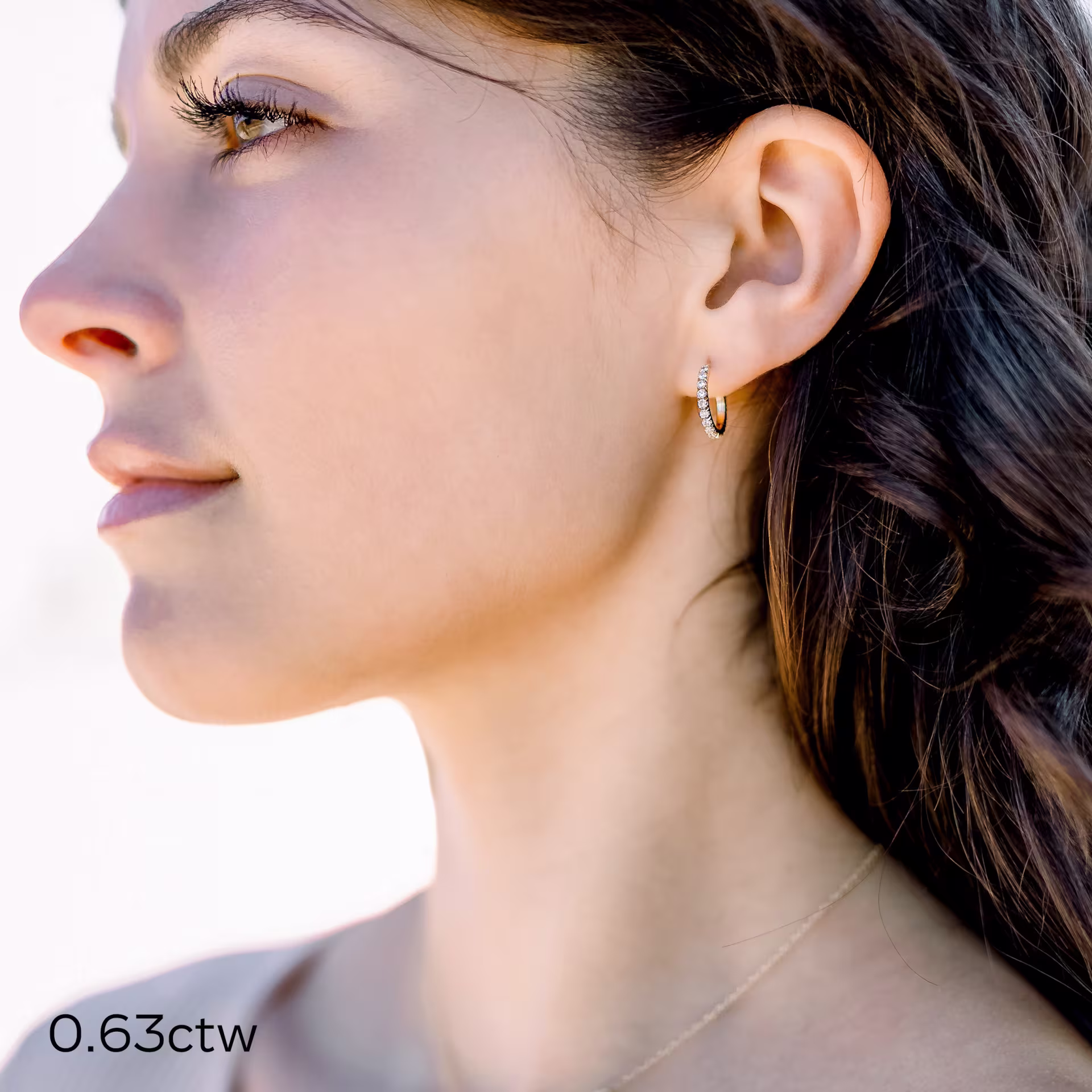 0.63 ct Round Lab Diamonds set in 14k Yellow Gold 0.63ctw Diamond J Huggie Hoop Earrings in 14k Yellow Gold (Main View)