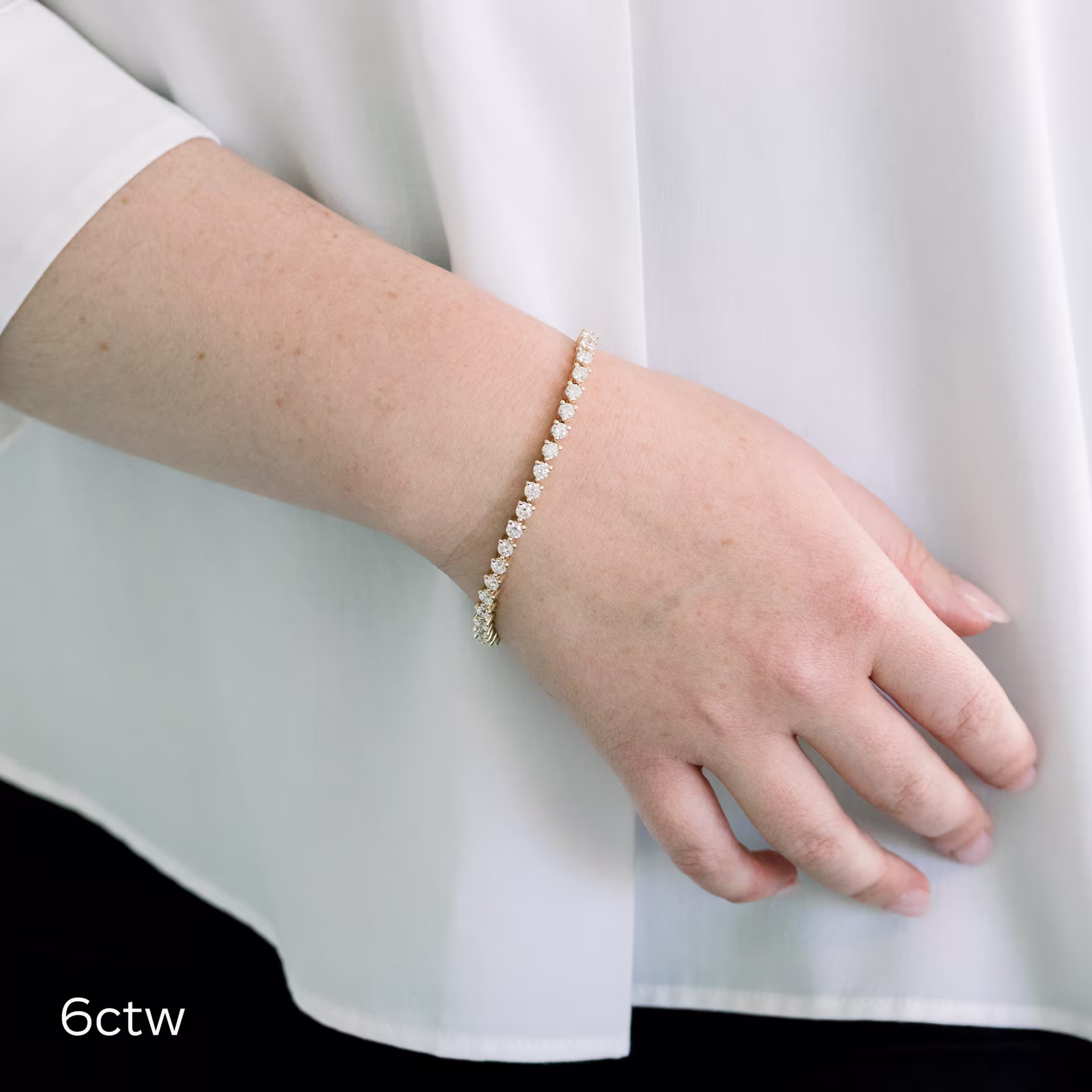 14kt Yellow Gold Three Prong Tennis Bracelet featuring 6.0 Carat Round Synthetic Diamonds (Main View)