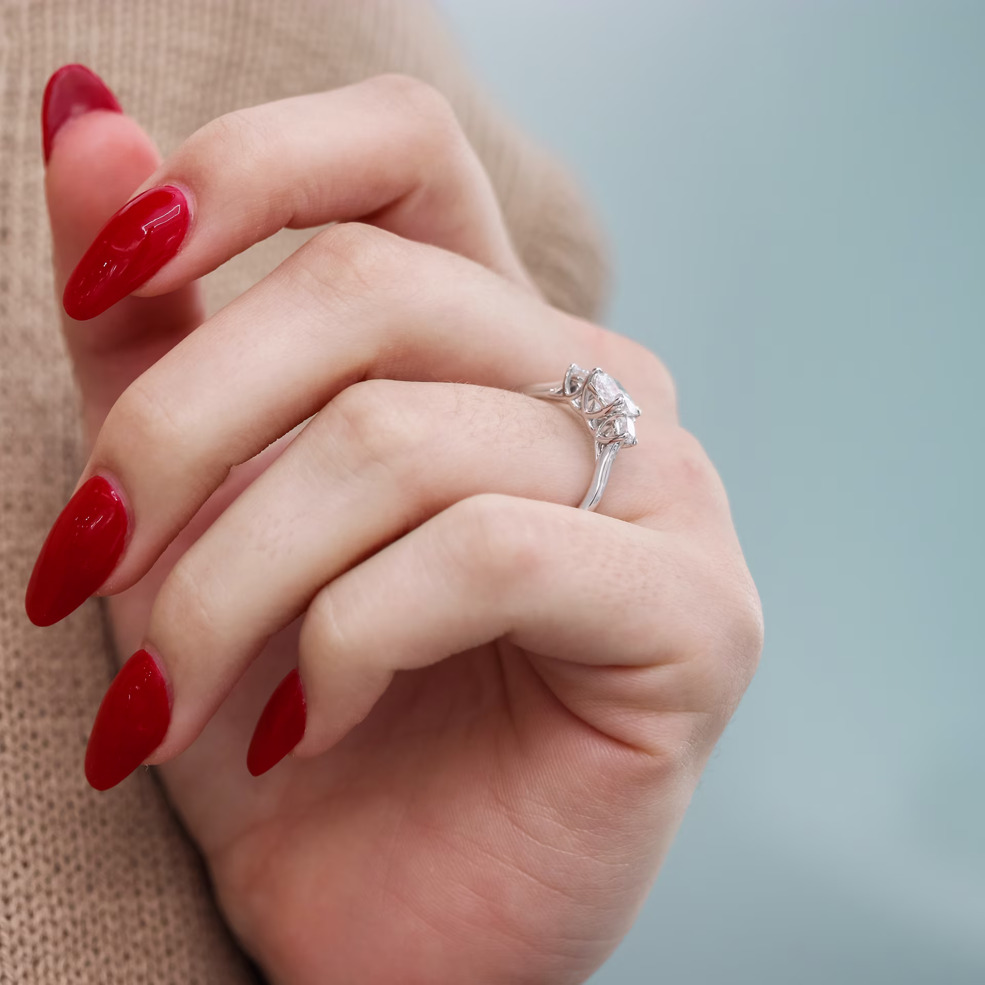 1.25 ct Man Made Diamonds set in Platinum Cushion Three Stone Setting (Profile View)