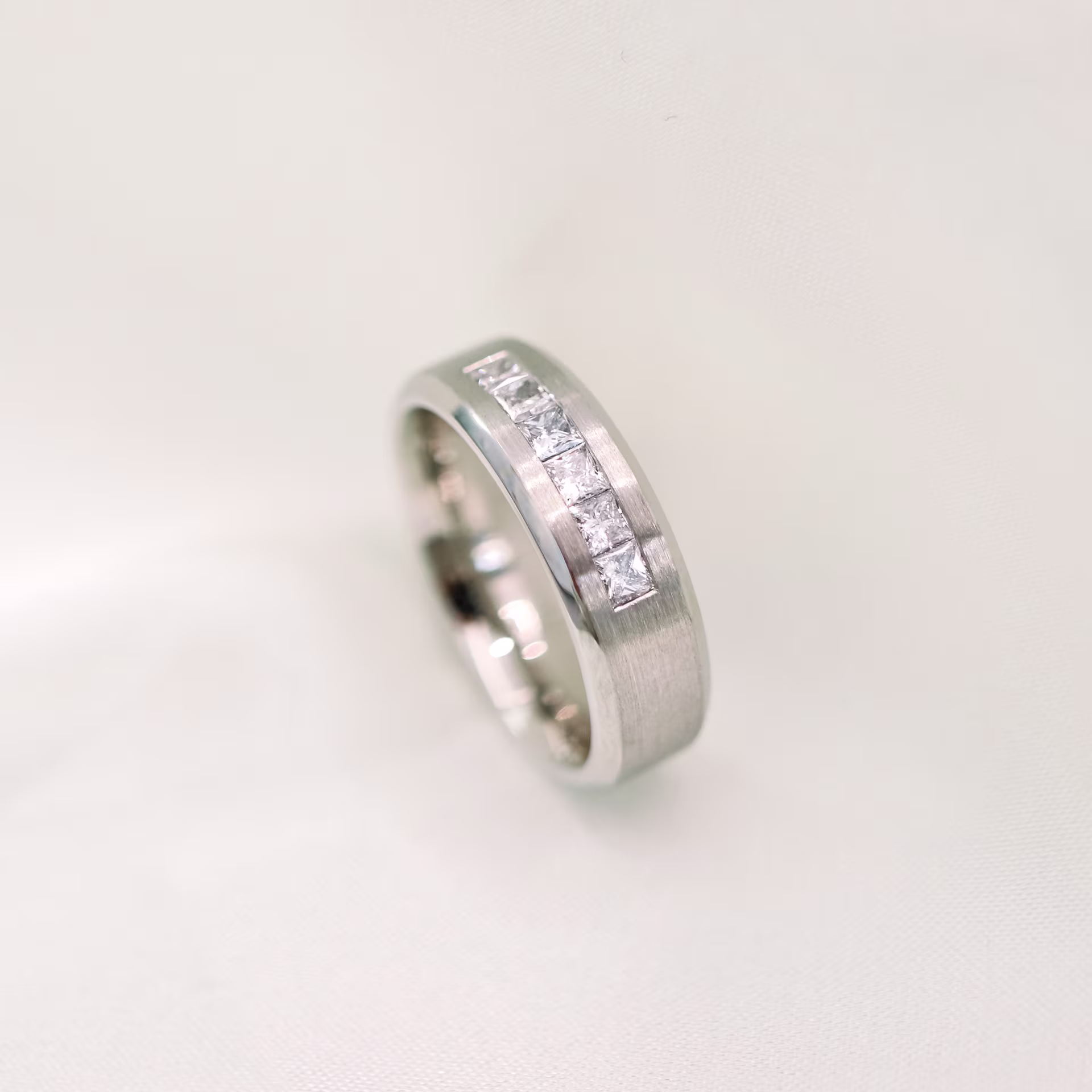 Exceptional Quality 1.0 Carat Lab Diamonds Matte Beveled Channel Princess Half Band in Platinum (Profile View)