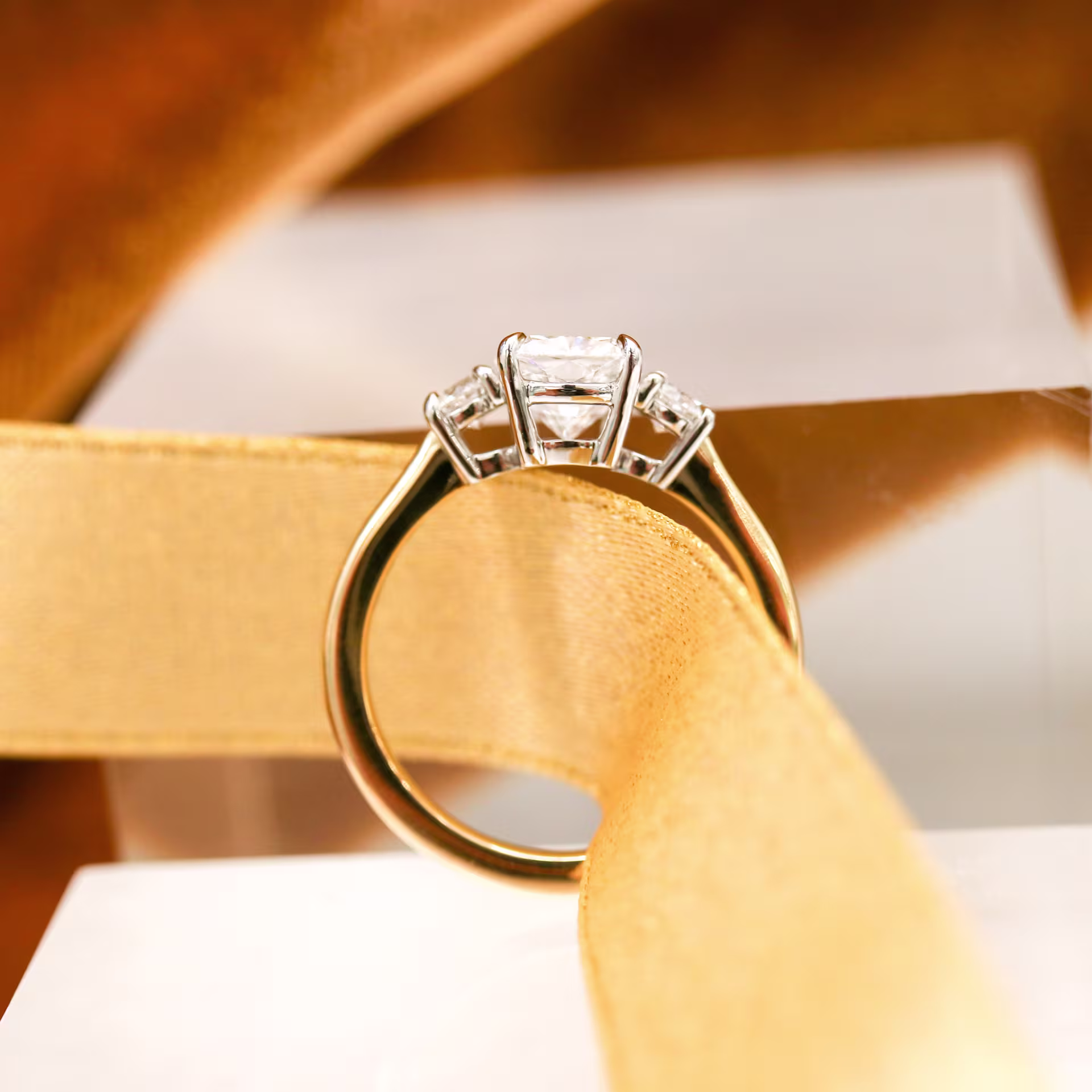 High Quality 2.0 ct Synthetic Diamonds set in Platinum & Yellow Gold Cushion and Round Diamond Engagement Ring (Profile View)