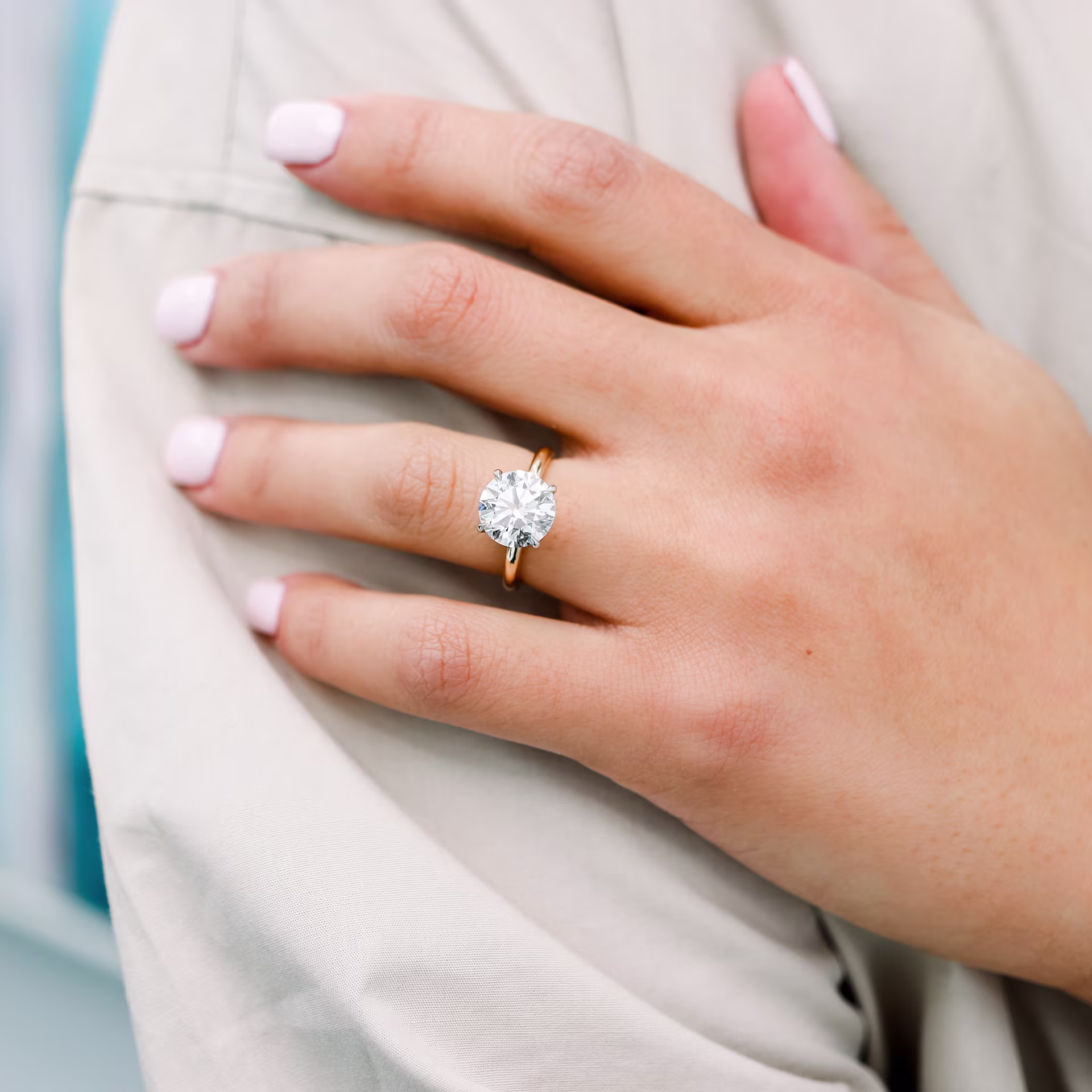 4 carat round lab diamond engagement ring on model 