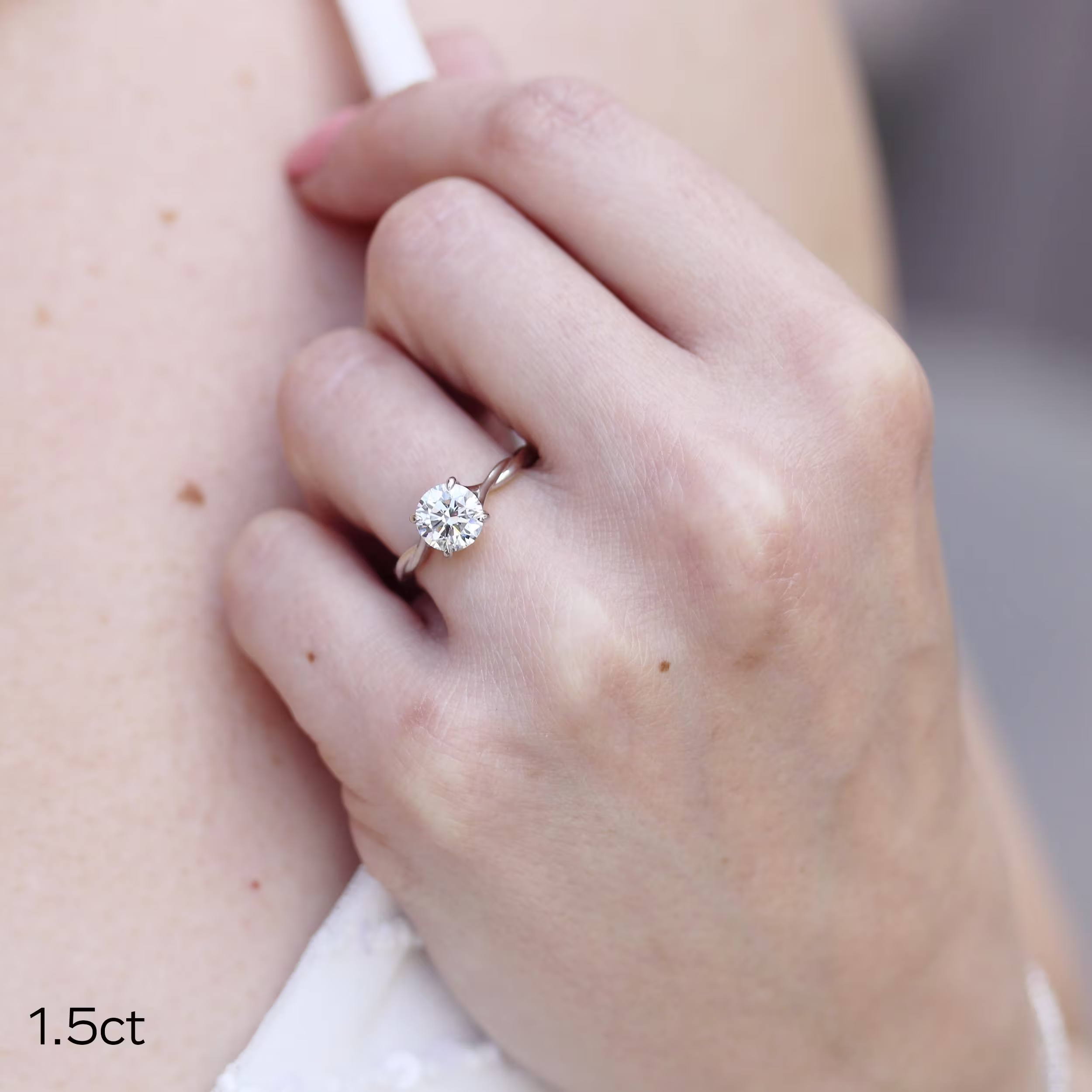 1.5ct round lab diamond solitaire engagement ring with twisting band in platinum design 366