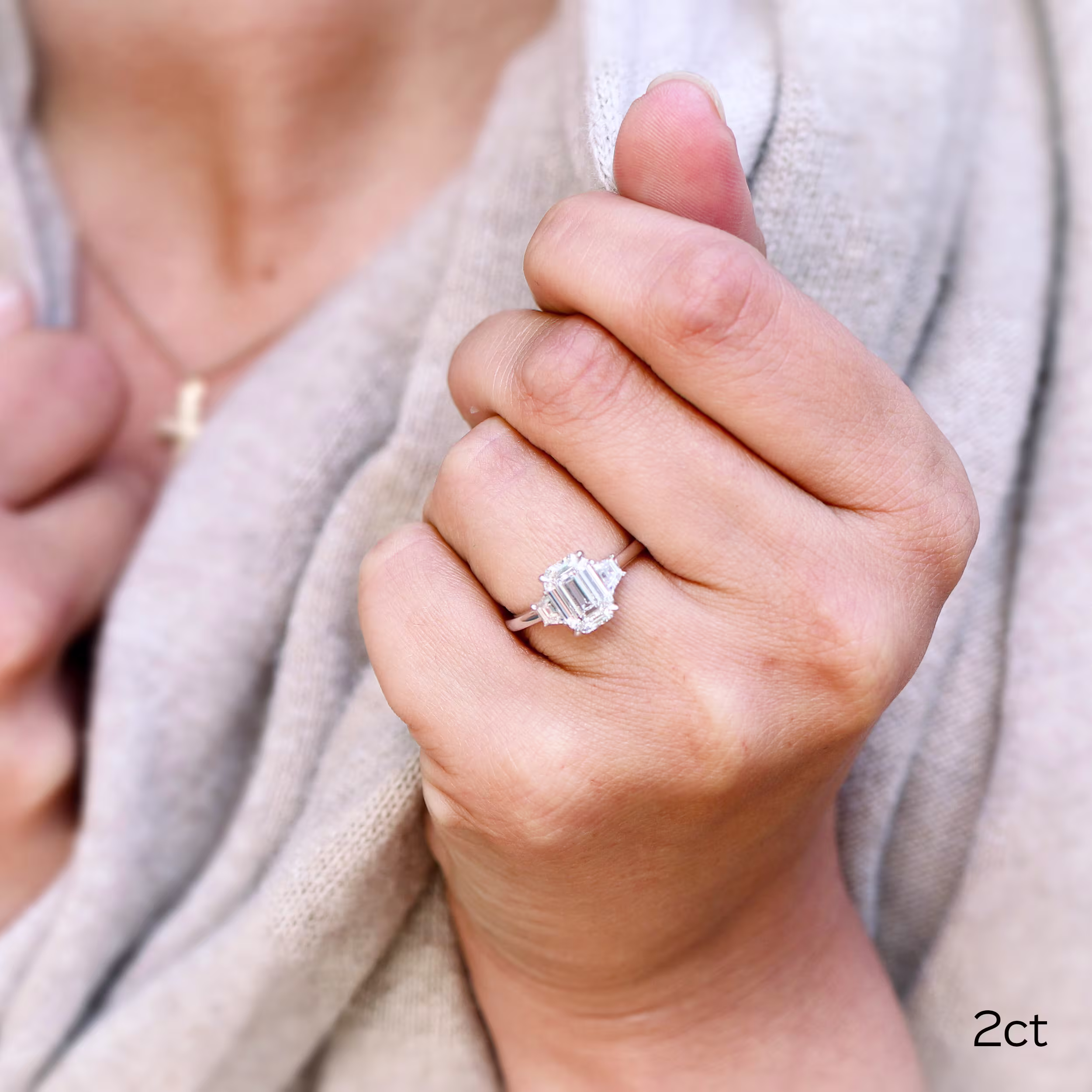 2 ct lab made emerald cut diamond and trapezoid side stones