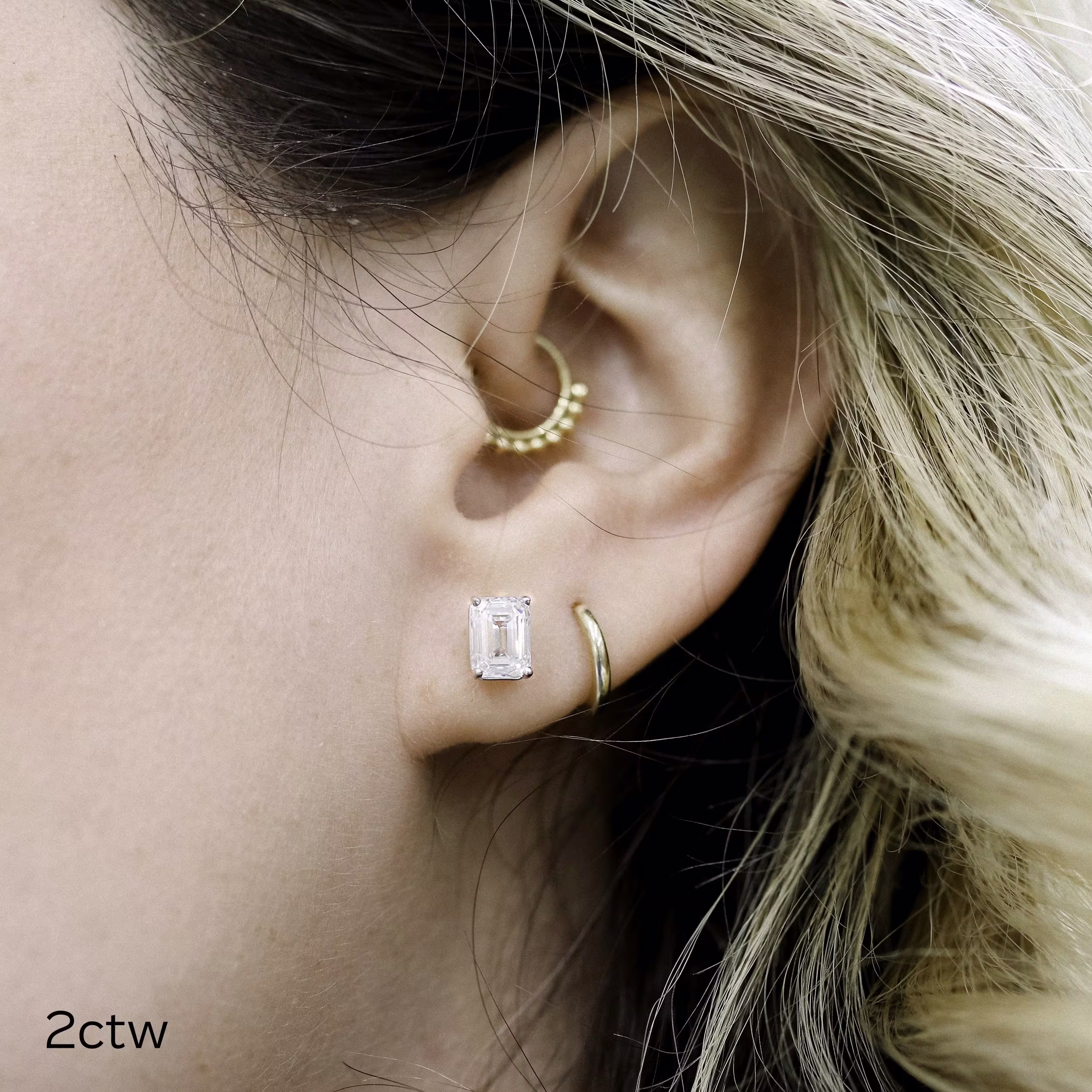 two carat total weight white gold emerald cut stud earrings made with lab grown diamonds ada diamonds 003 on model