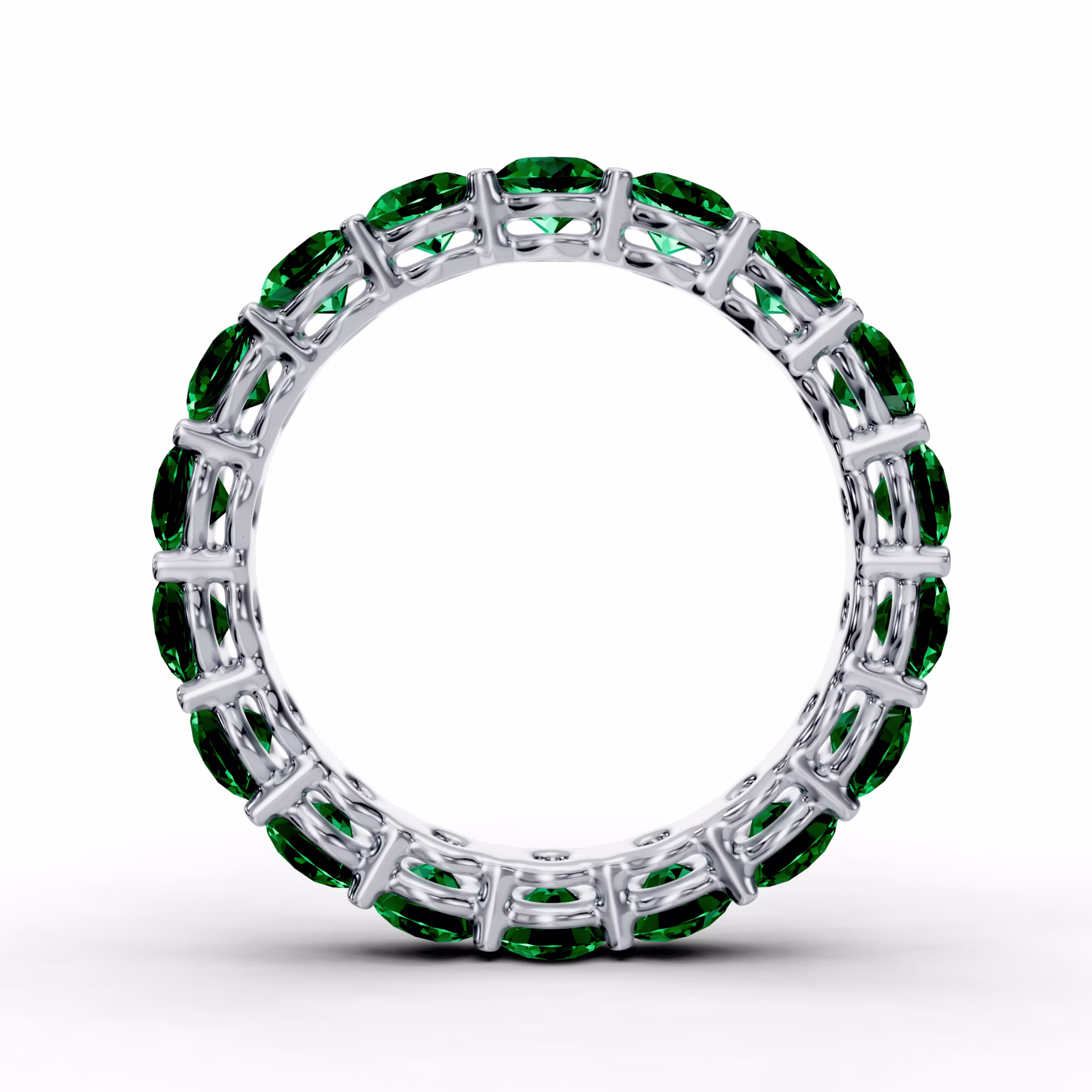 Front view of a platinum prong set eternity band featuring 3.5 mm round emeralds, designed as a wedding band.