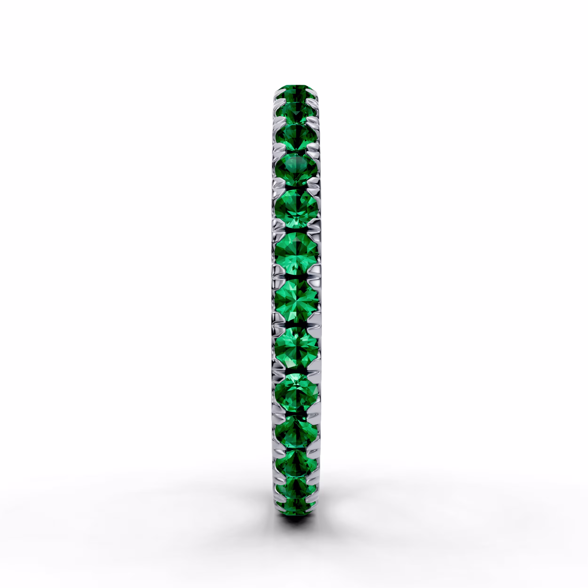 Platinum round emerald U pavé eternity wedding band in white metal with melee stones.