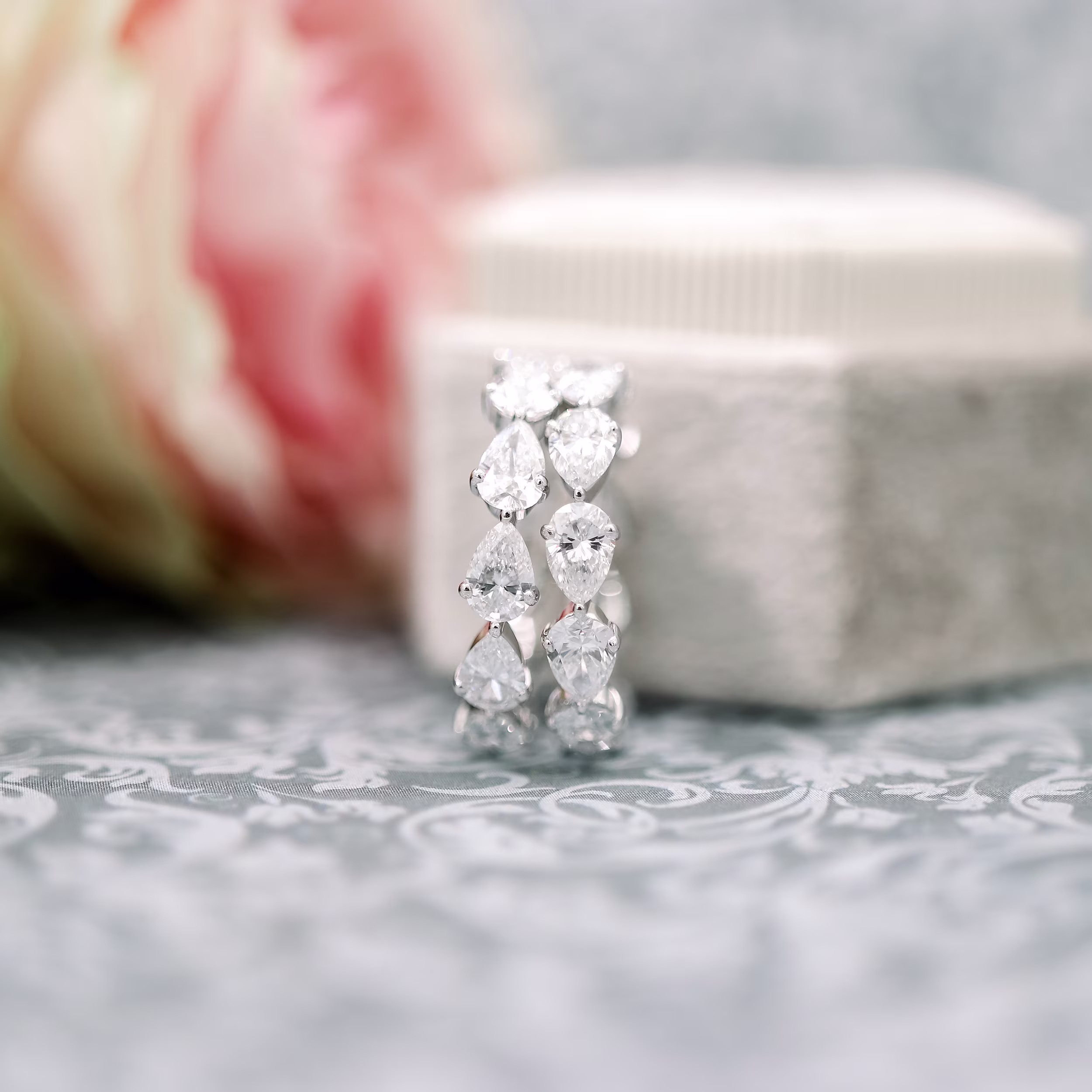 High Quality 3.0 Carat Man Made Diamonds set in 18k White Gold Pear East-West Eternity Band (Profile View)